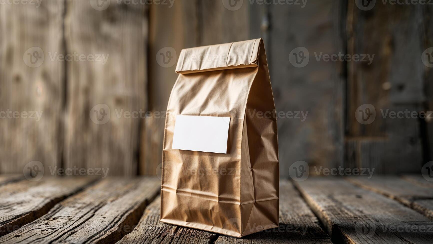 Brown paper bag standing on rustic wood with blank label for product packaging photo