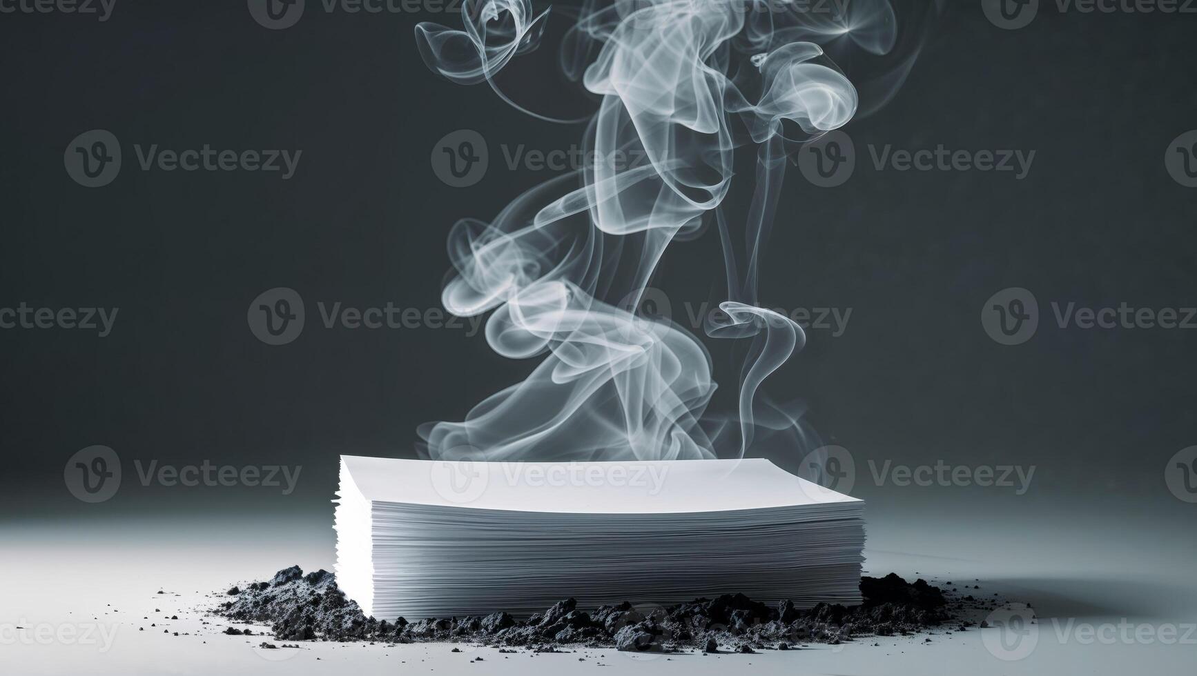 A stack of papers with smoke coming out of it photo