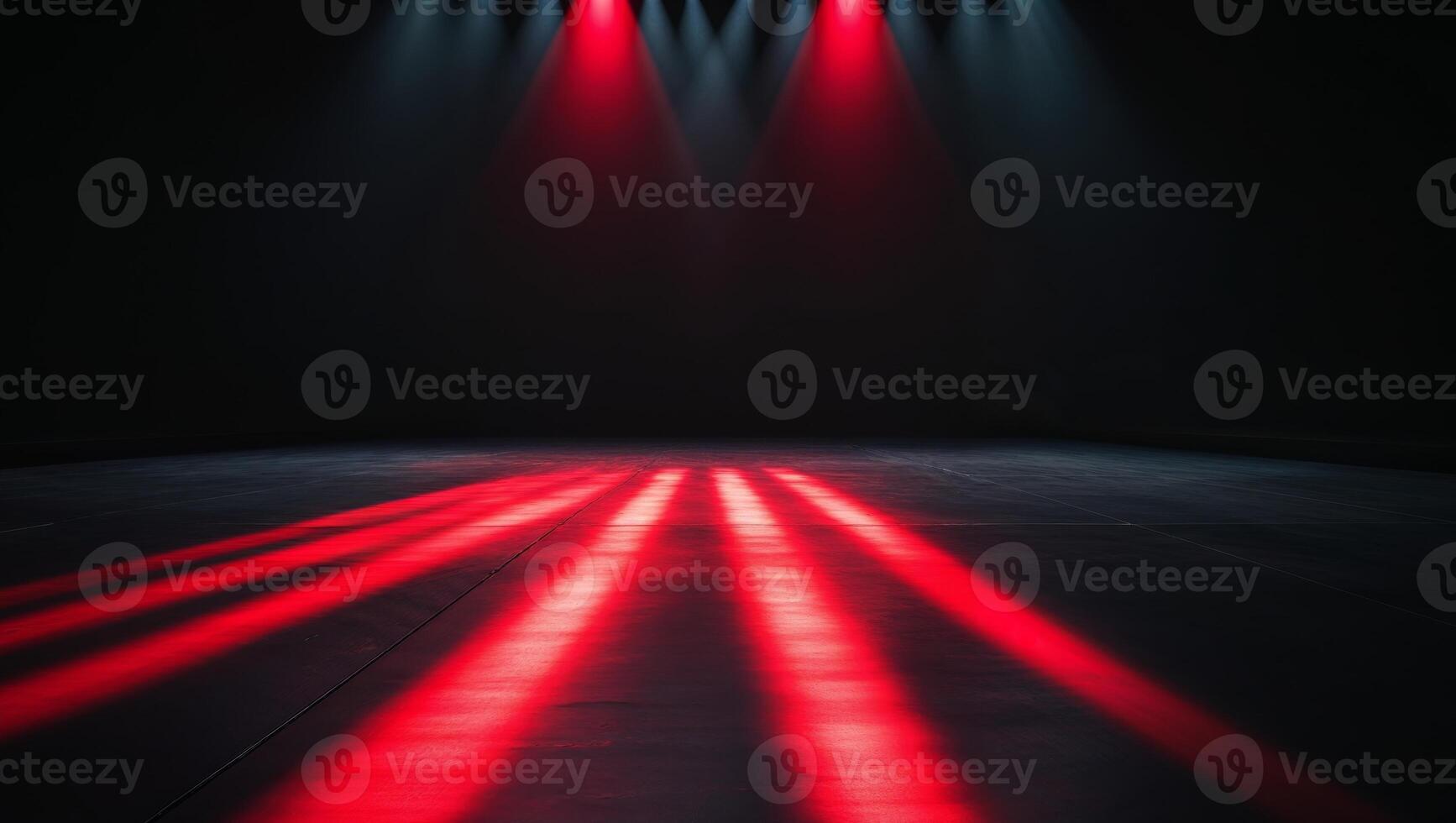 Empty modern stage lit by red spotlights at night photo