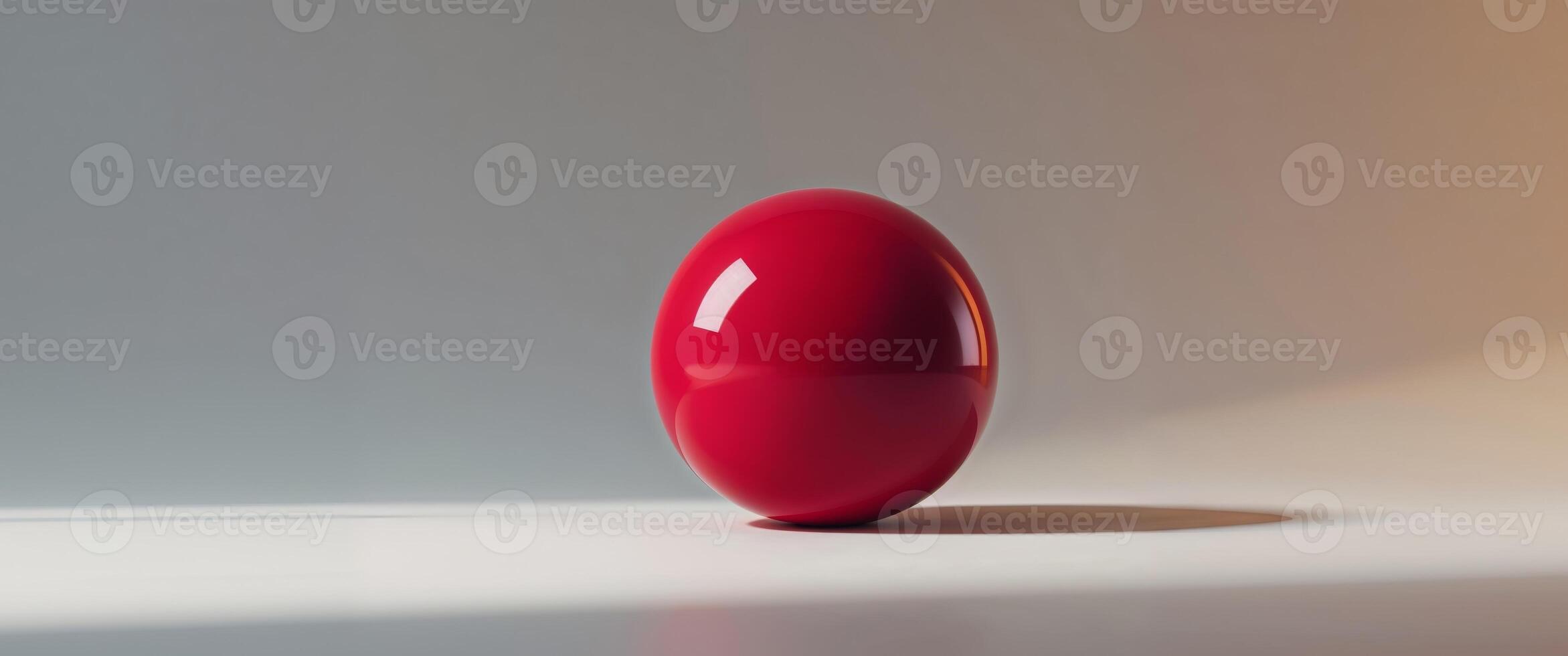 A red ball sitting on a table photo
