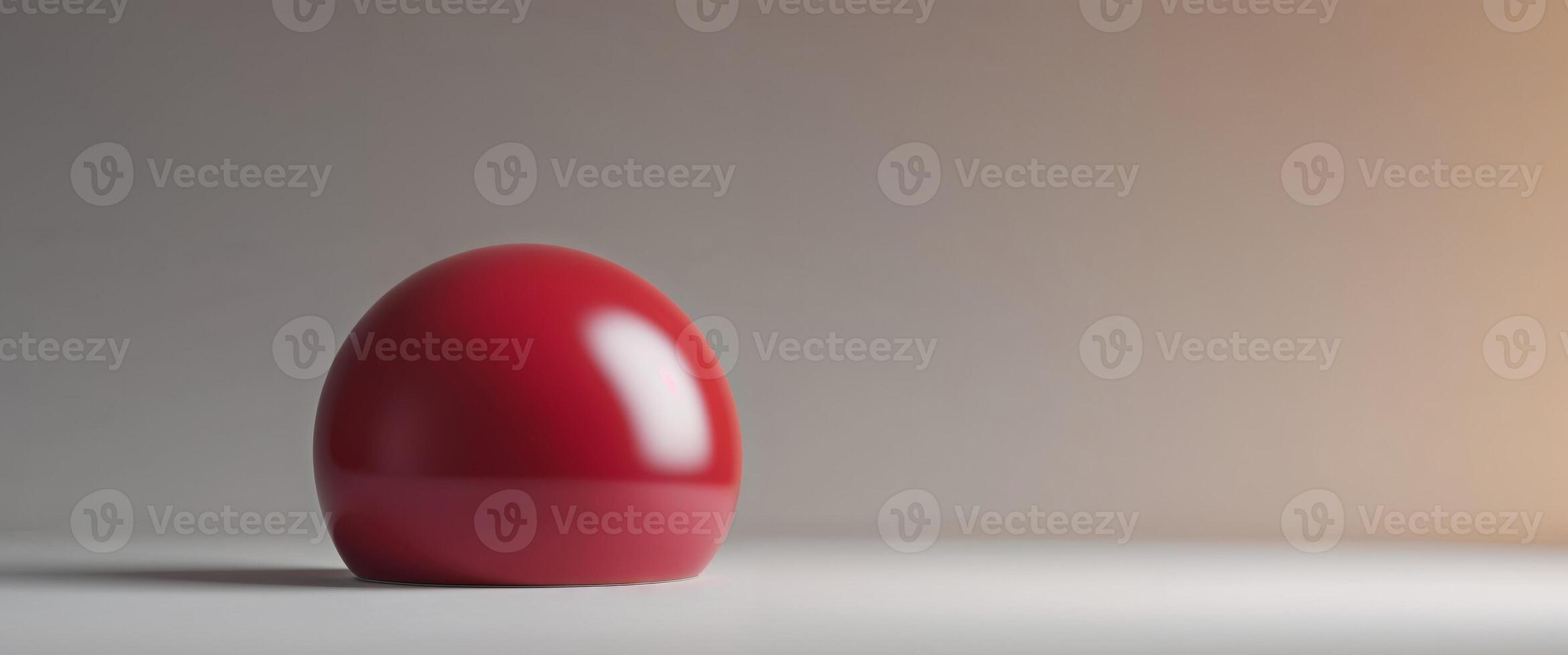 A red egg sitting on a table photo