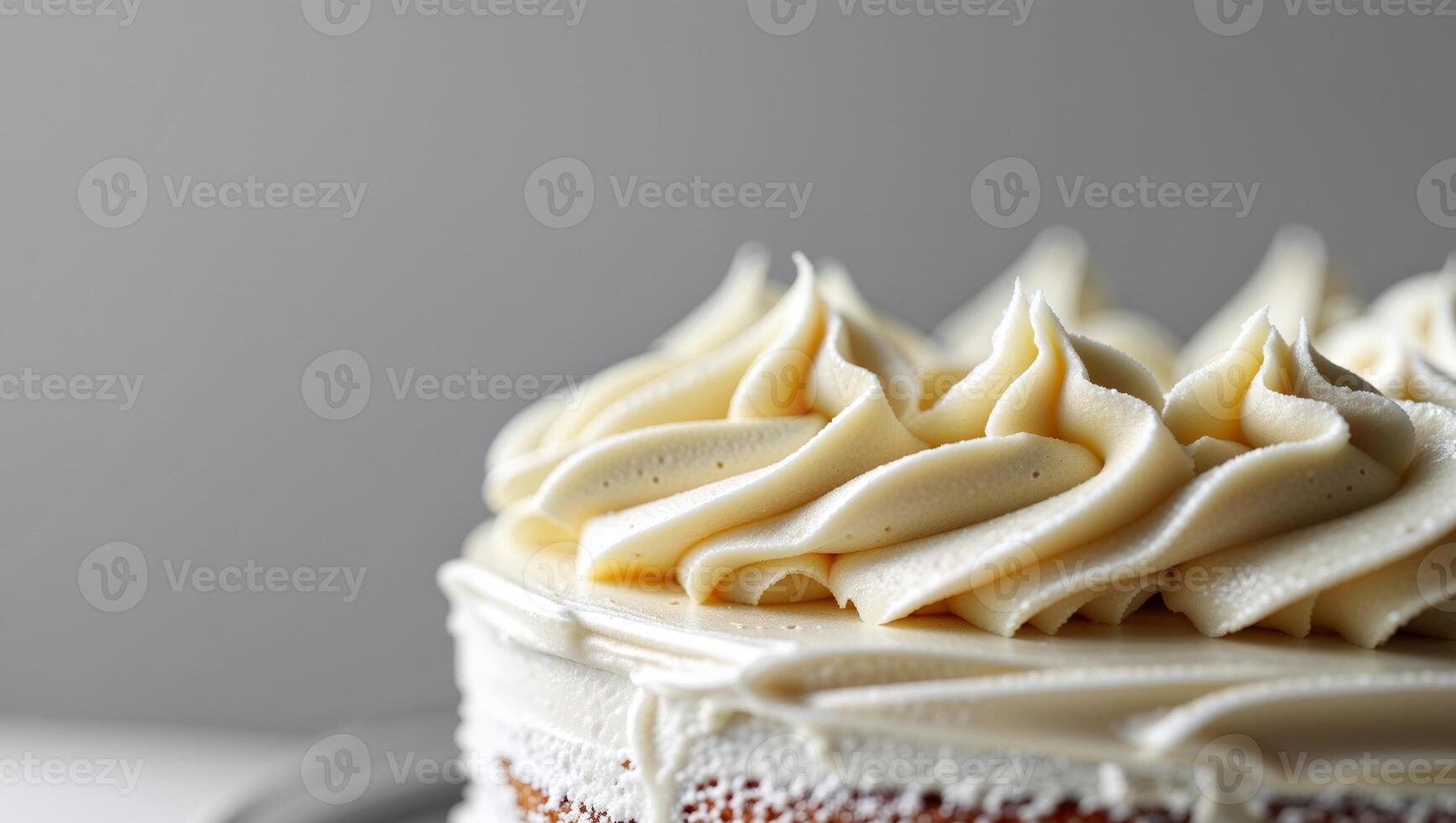 A cake with white frosting on top photo