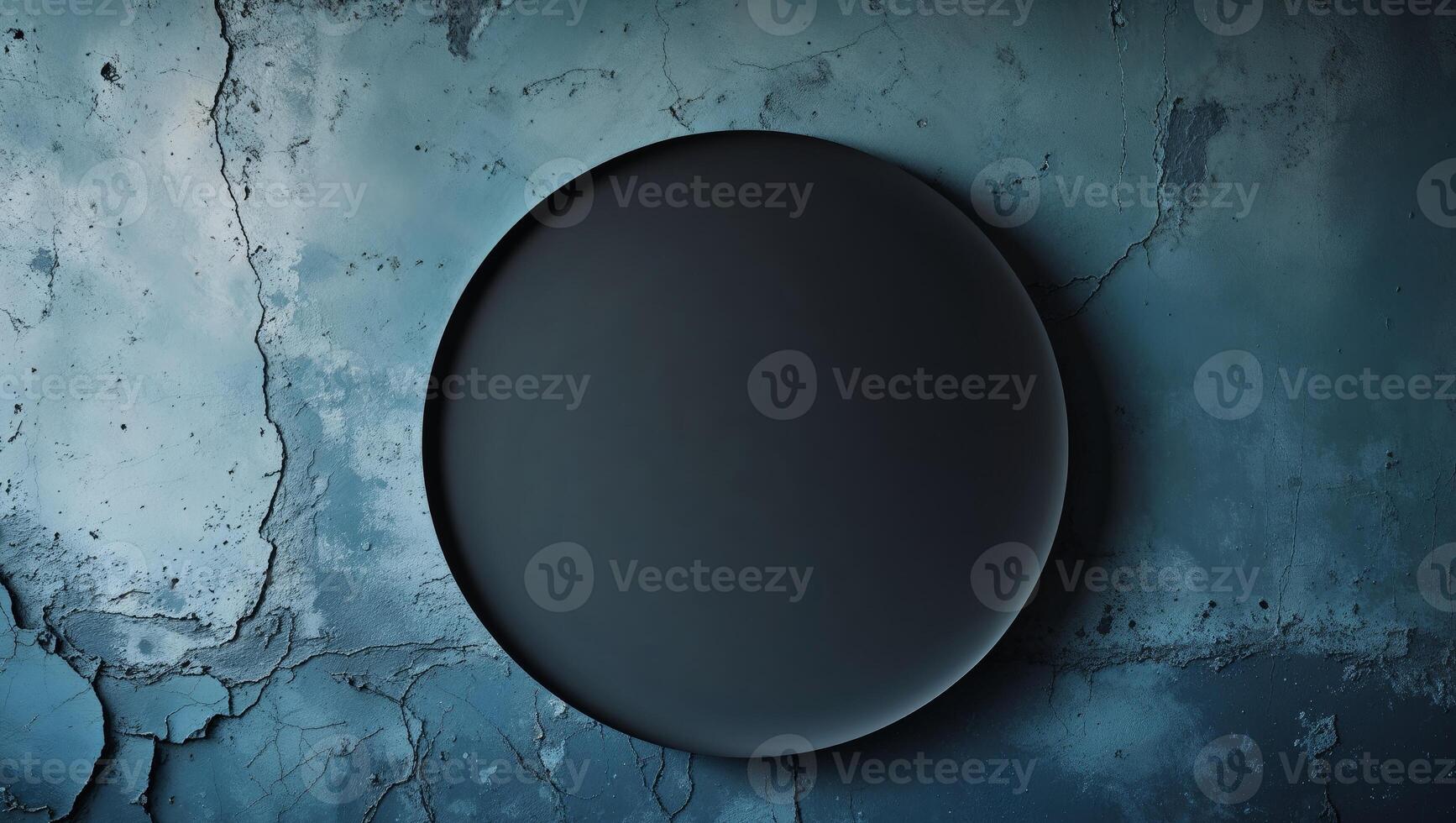 Abstract background with black circle in center of blue grunge wall texture photo