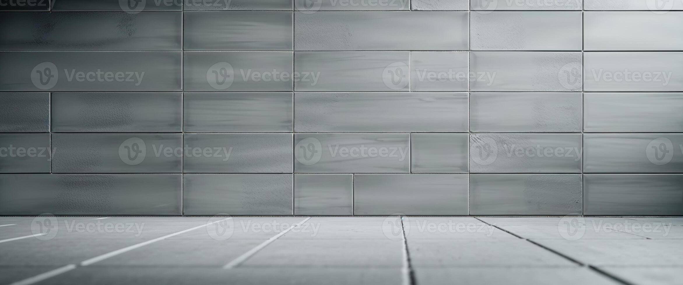 Decorative rectangular wall tiles in a muted gray tone photo