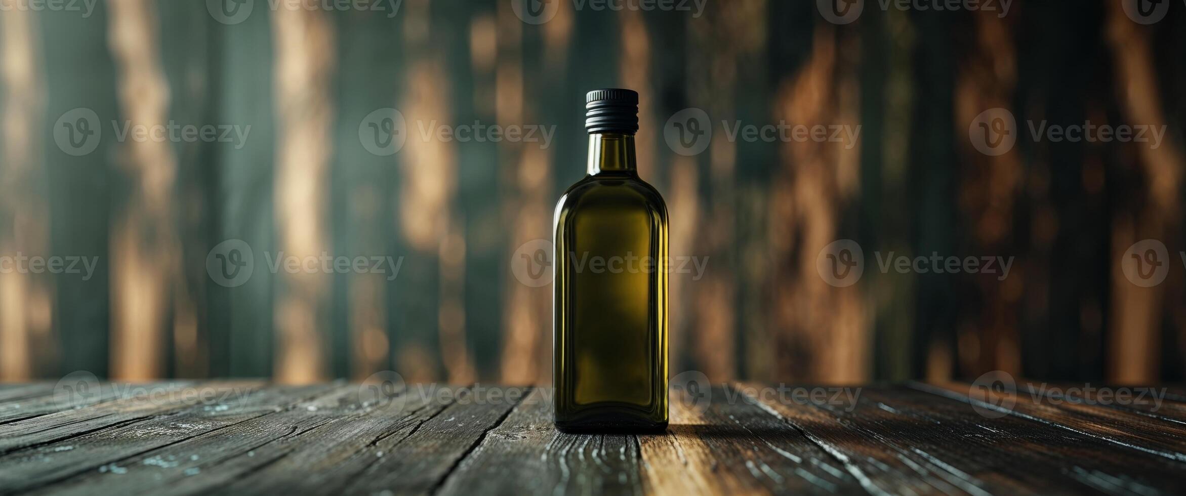 A bottle of wine sitting on a wooden table photo