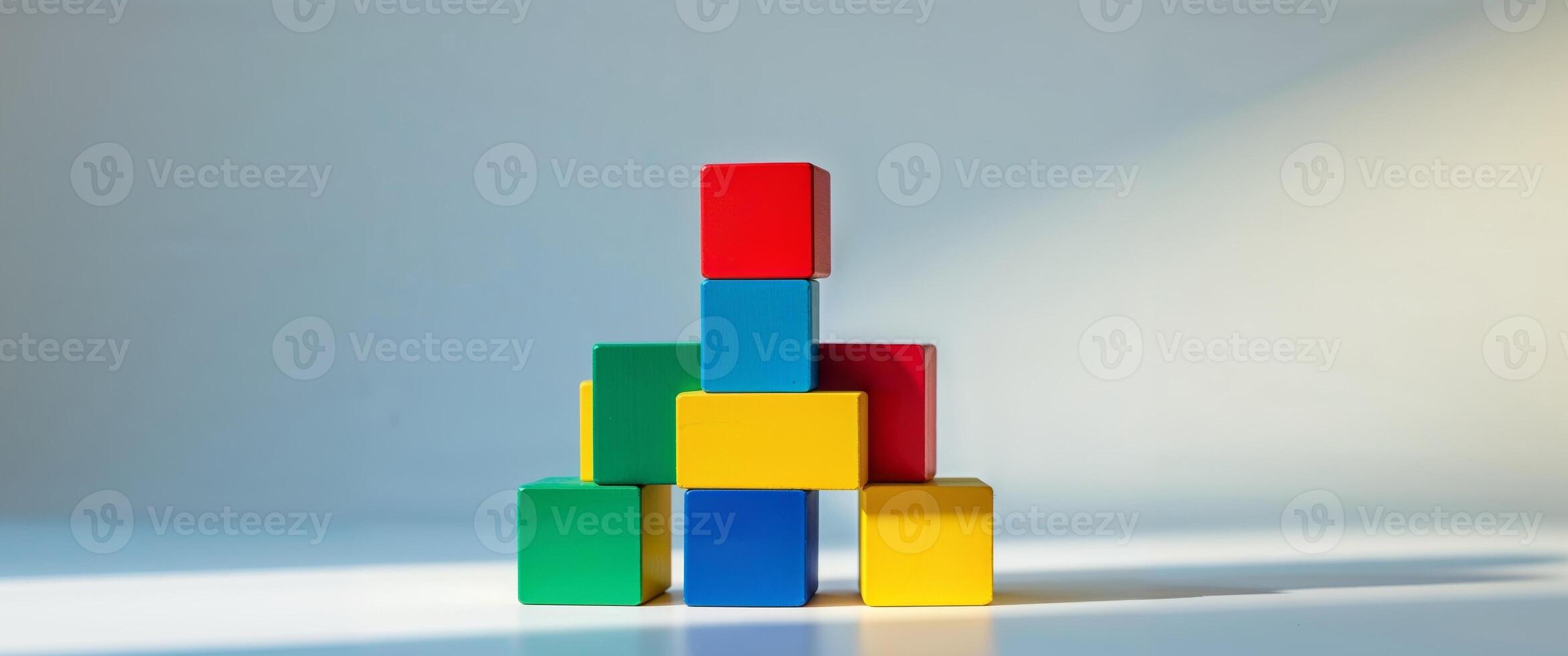A stack of colorful wooden blocks on a table photo