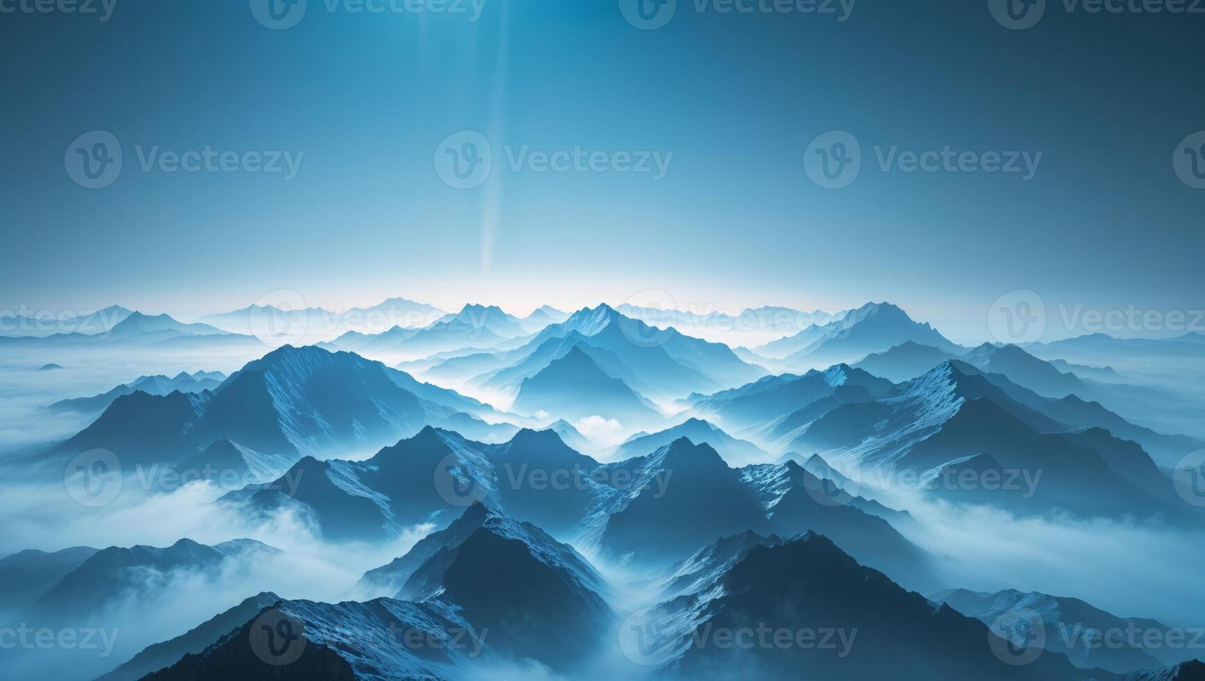 A mountain range with fog and sun photo