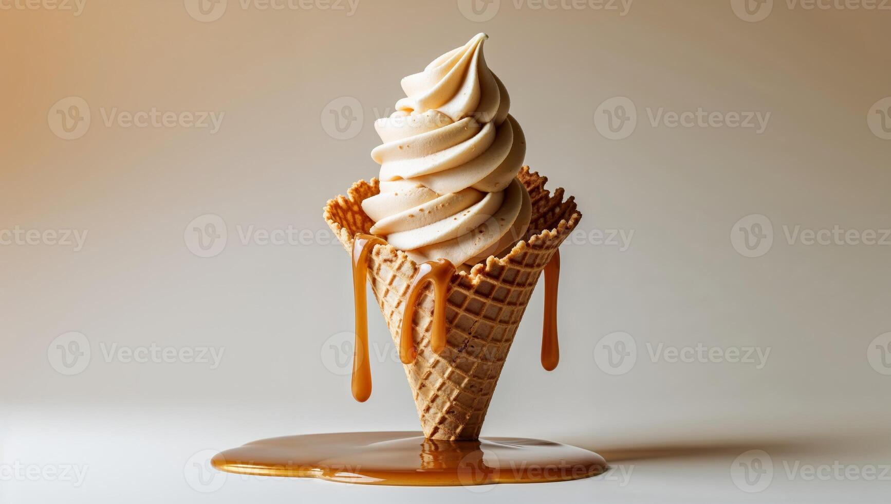 Caramel Swirl Ice Cream In Waffle Cone On Light Background With Delicious Caramel Drizzle photo