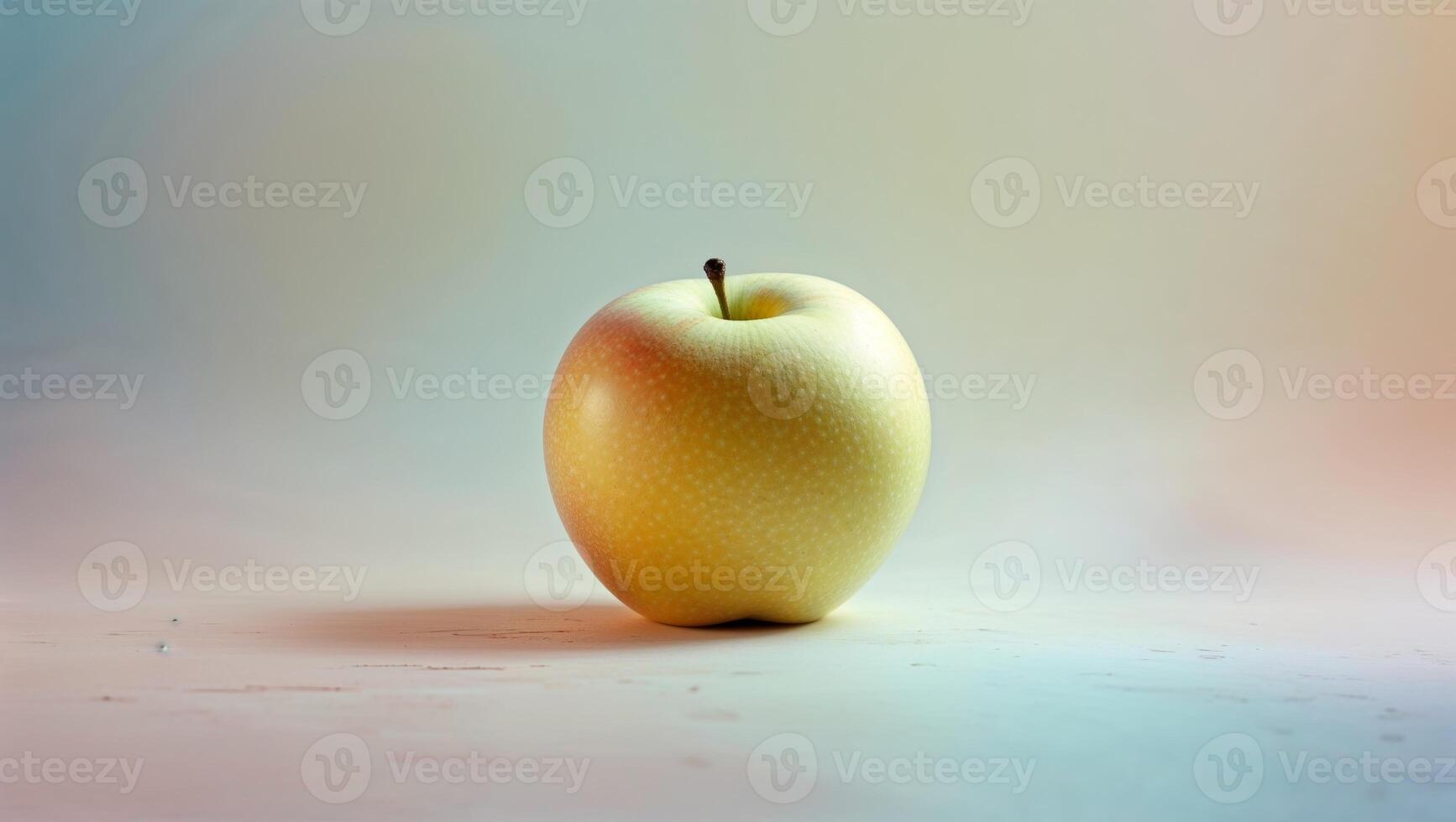 Soft focus yellow apple on pastel background photo