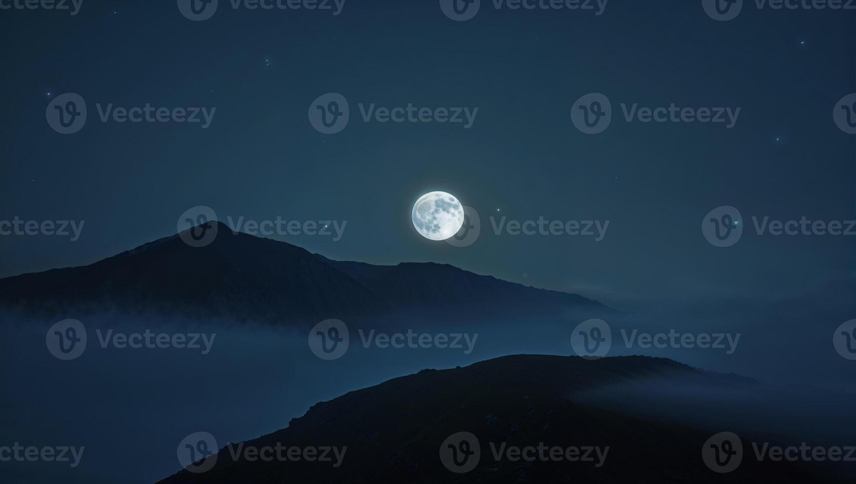 a moonlit on a mountain top photo