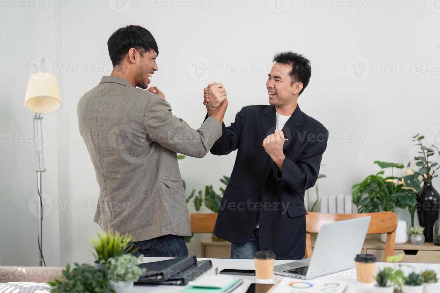 Business Engagement and Team Spirit. Two colleagues playfully challenging each other in a friendly office competition. photo