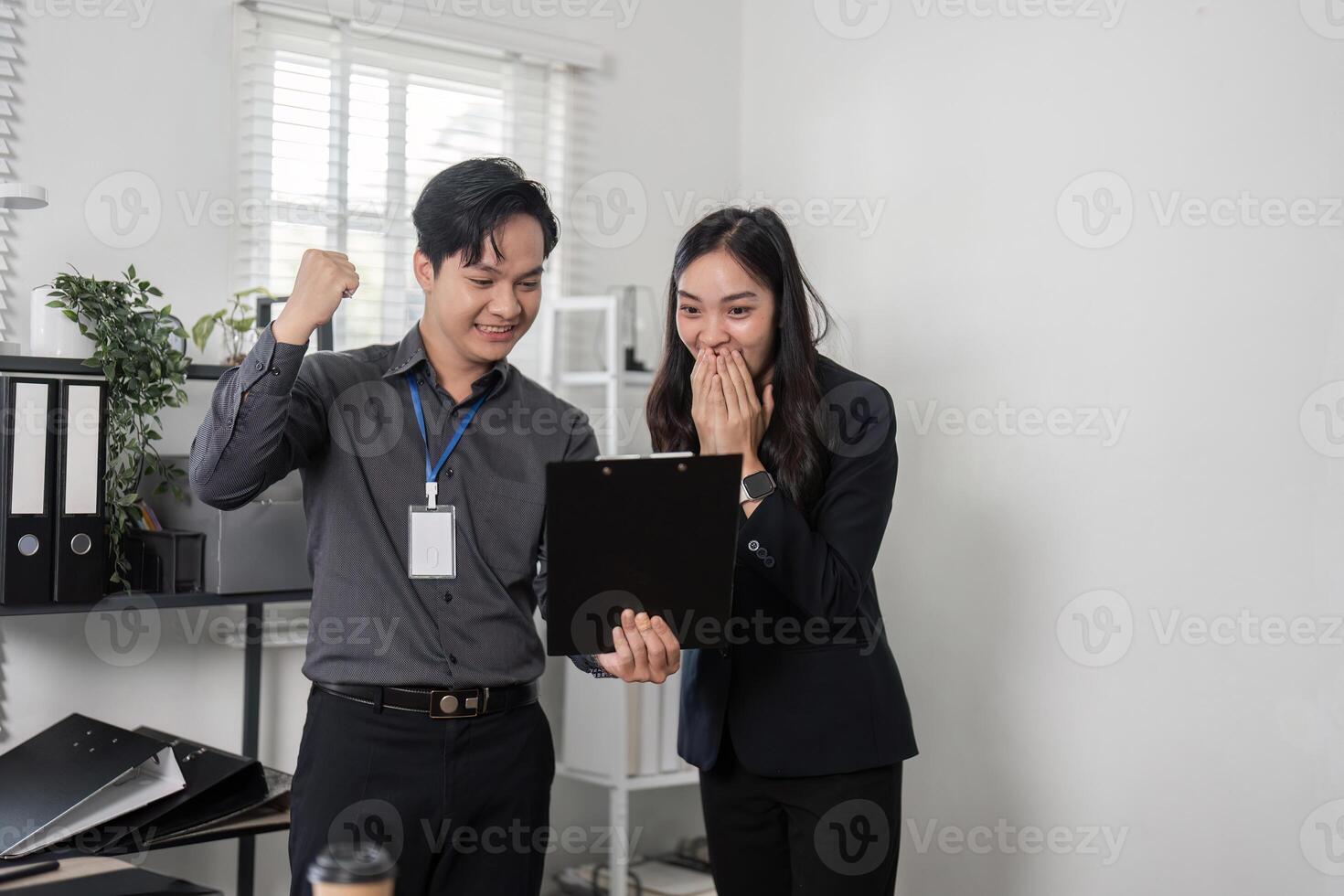 Business colleagues discussing project results in a bright office, highlighting teamwork and engagement. photo