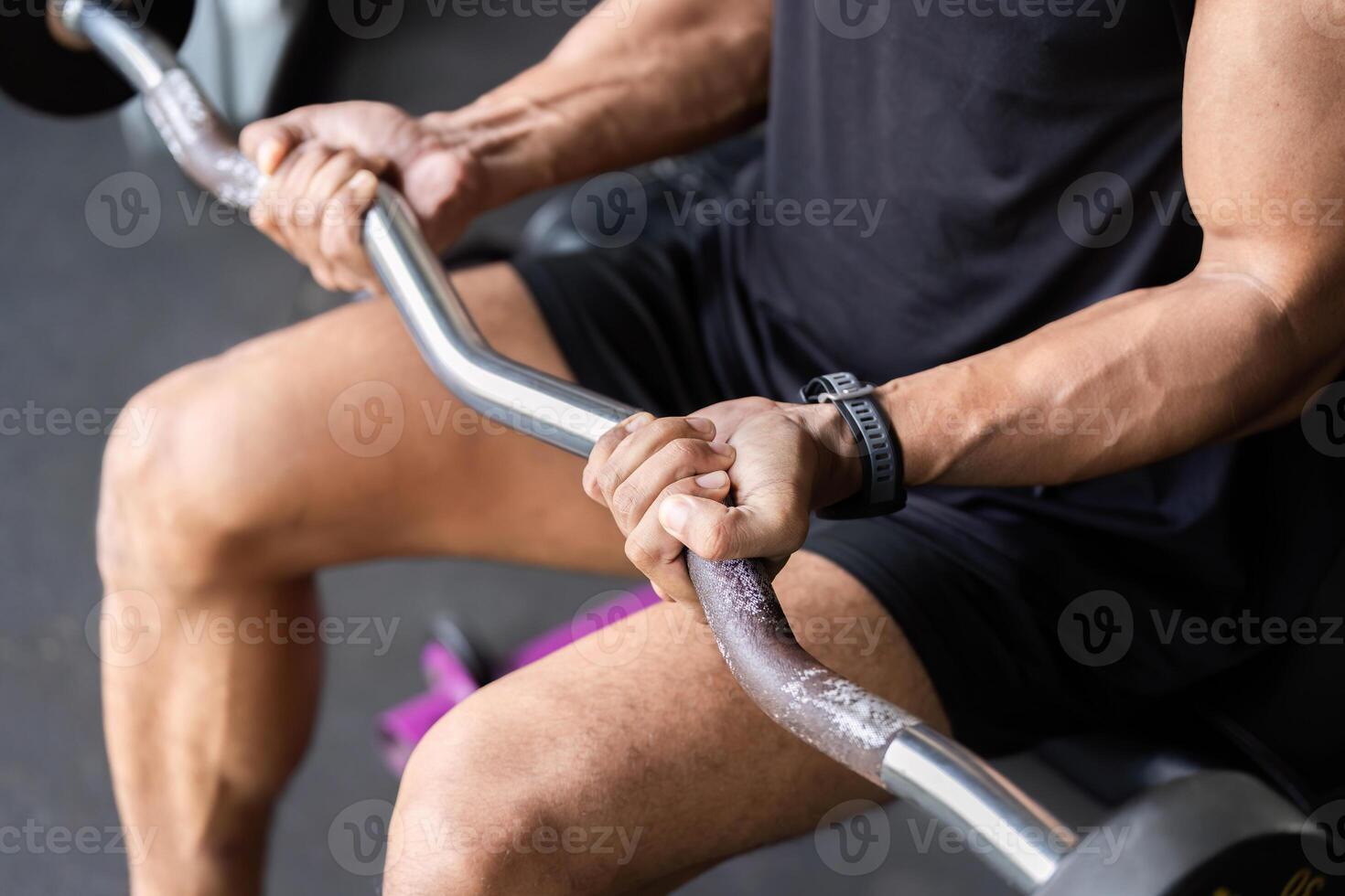 Strength Training Focus. Close-up of a Man Lifting a Barbell. photo