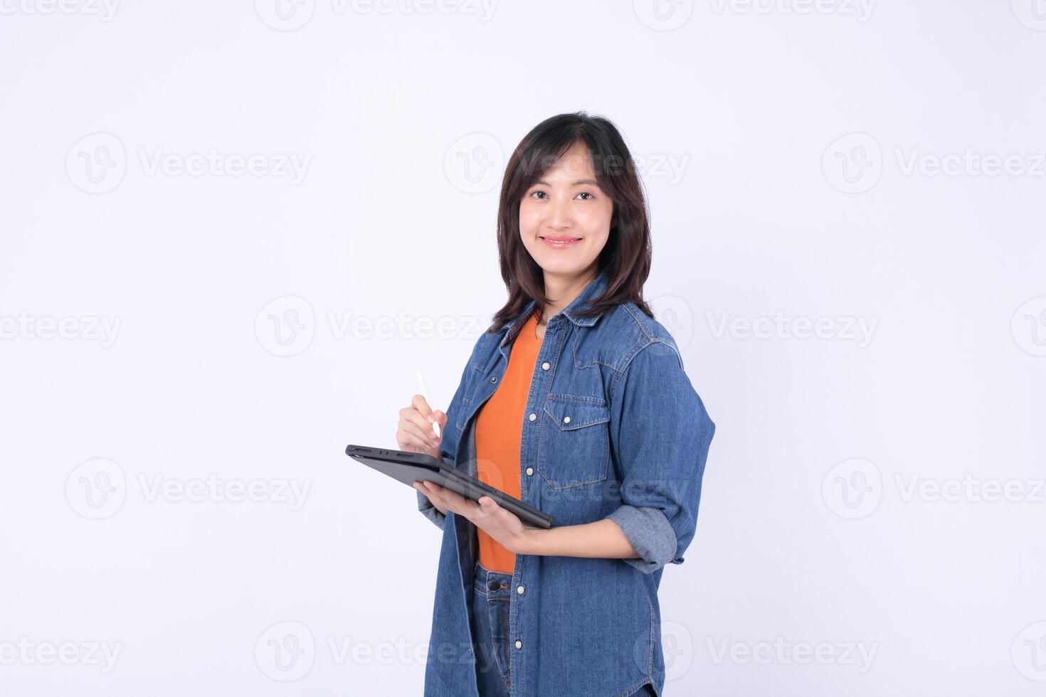 Southeast asian woman is small business owner using digital tablet for her creative online store in retail and startup industry with confident and happy expression photo
