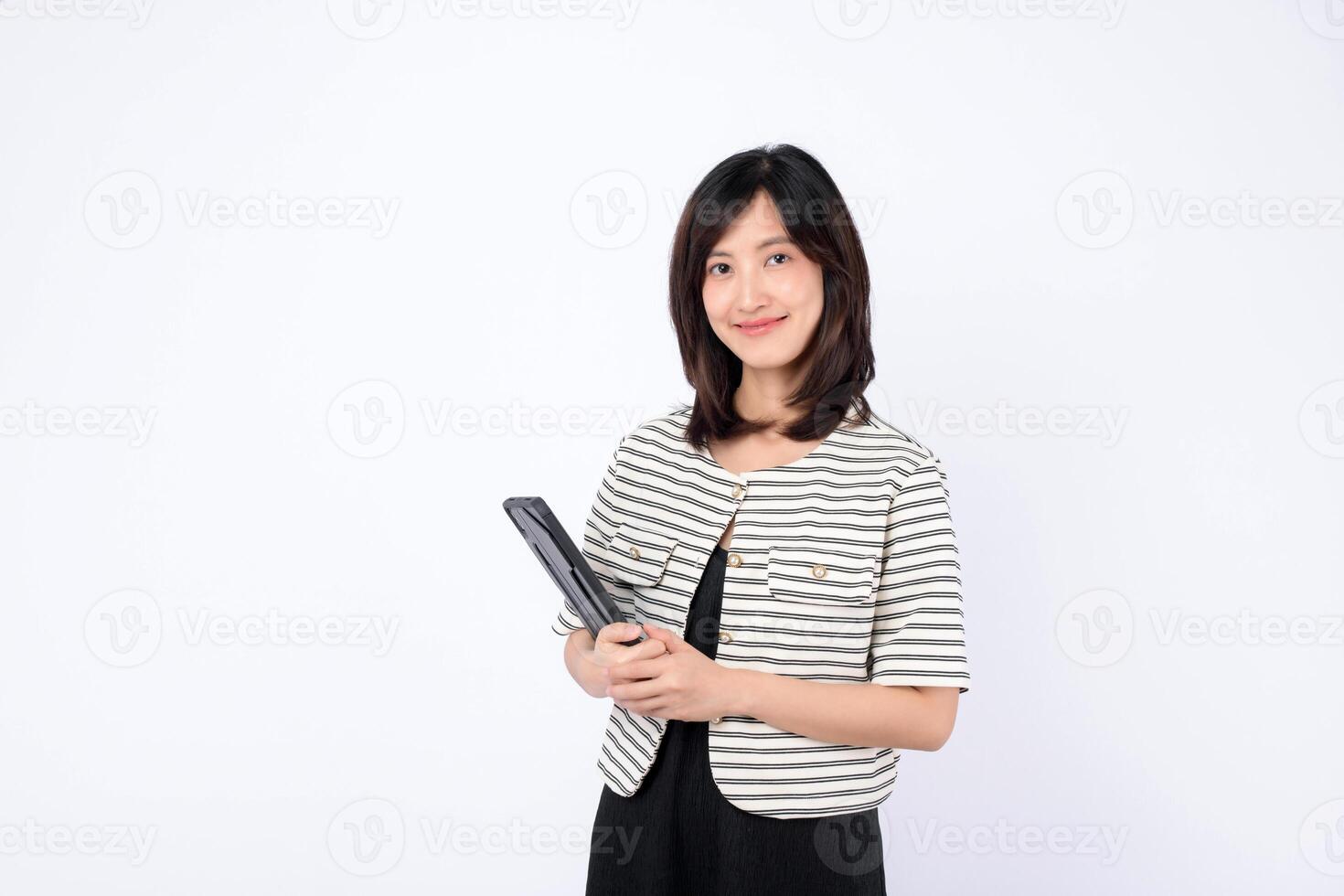 Southeast asian woman smiles confidently holding tablet representing small business owner in retail and online store startup industry with creative ideas and ambition photo