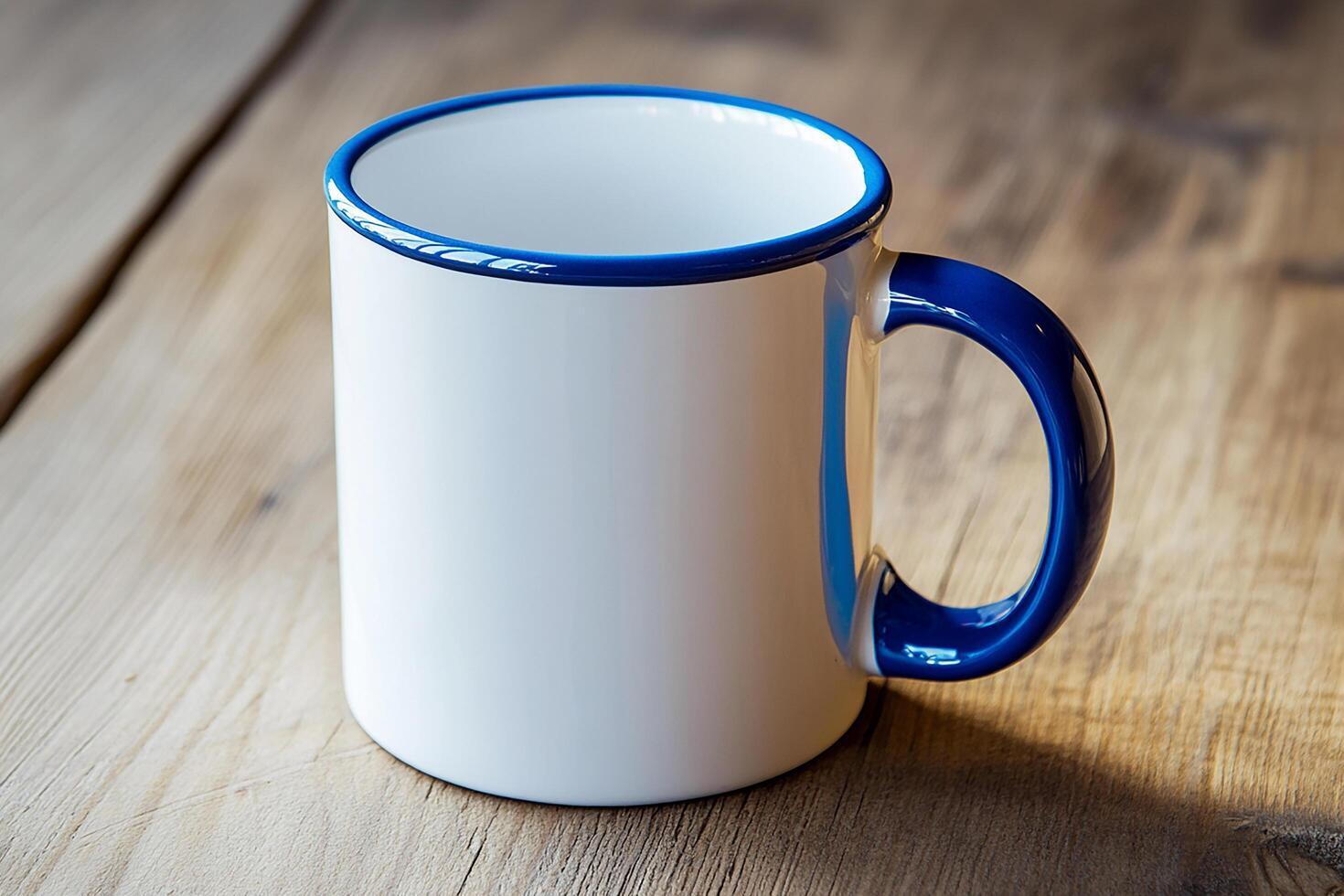 White coffee mug with glossy blue handle placed on table in soft light perfect for mockup or branding use photo