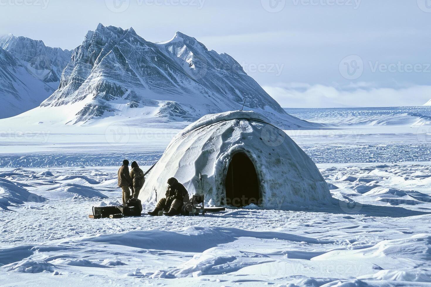 An inviting igloo in an untouched Arctic landscape, bathed in the silver glow of the moon. photo