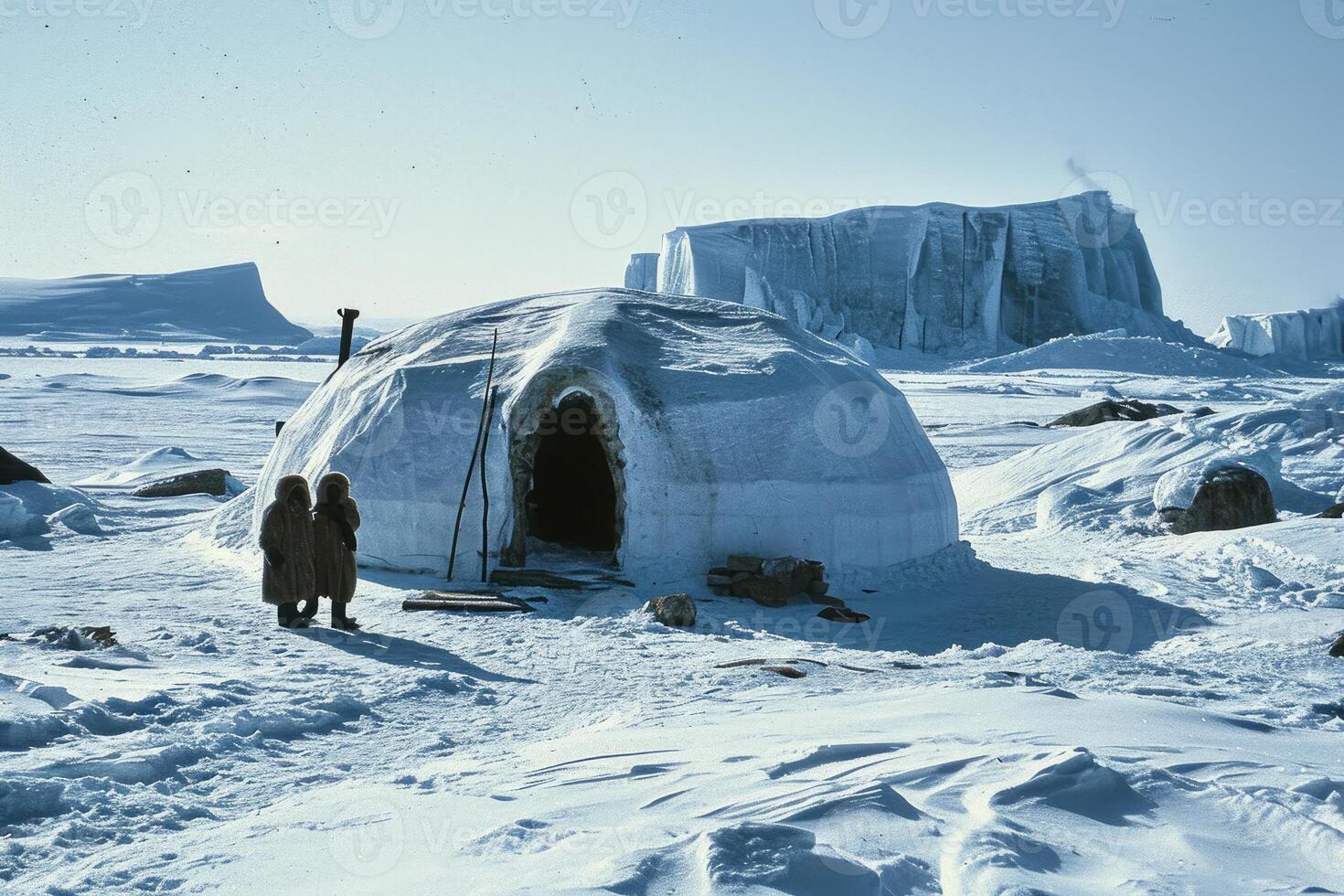 An igloo inhabited by Inuit people, surrounded by snowy landscape, A cozy igloo surrounded by snow-covered trees, set against a starry night backdrop. photo