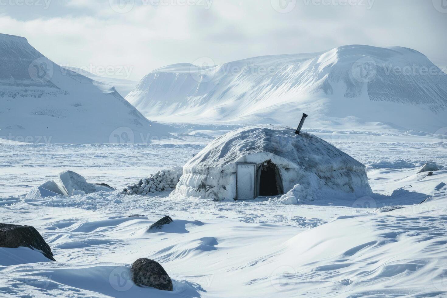 A hidden igloo deep in the Arctic wilderness, warmed by the soft glow of a fire inside. photo