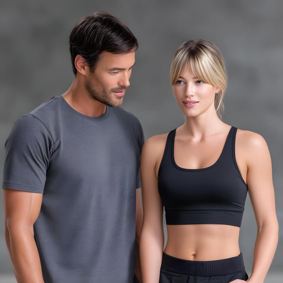Athletic Young Couple in Fitness Apparel Man and Woman Posing Together photo