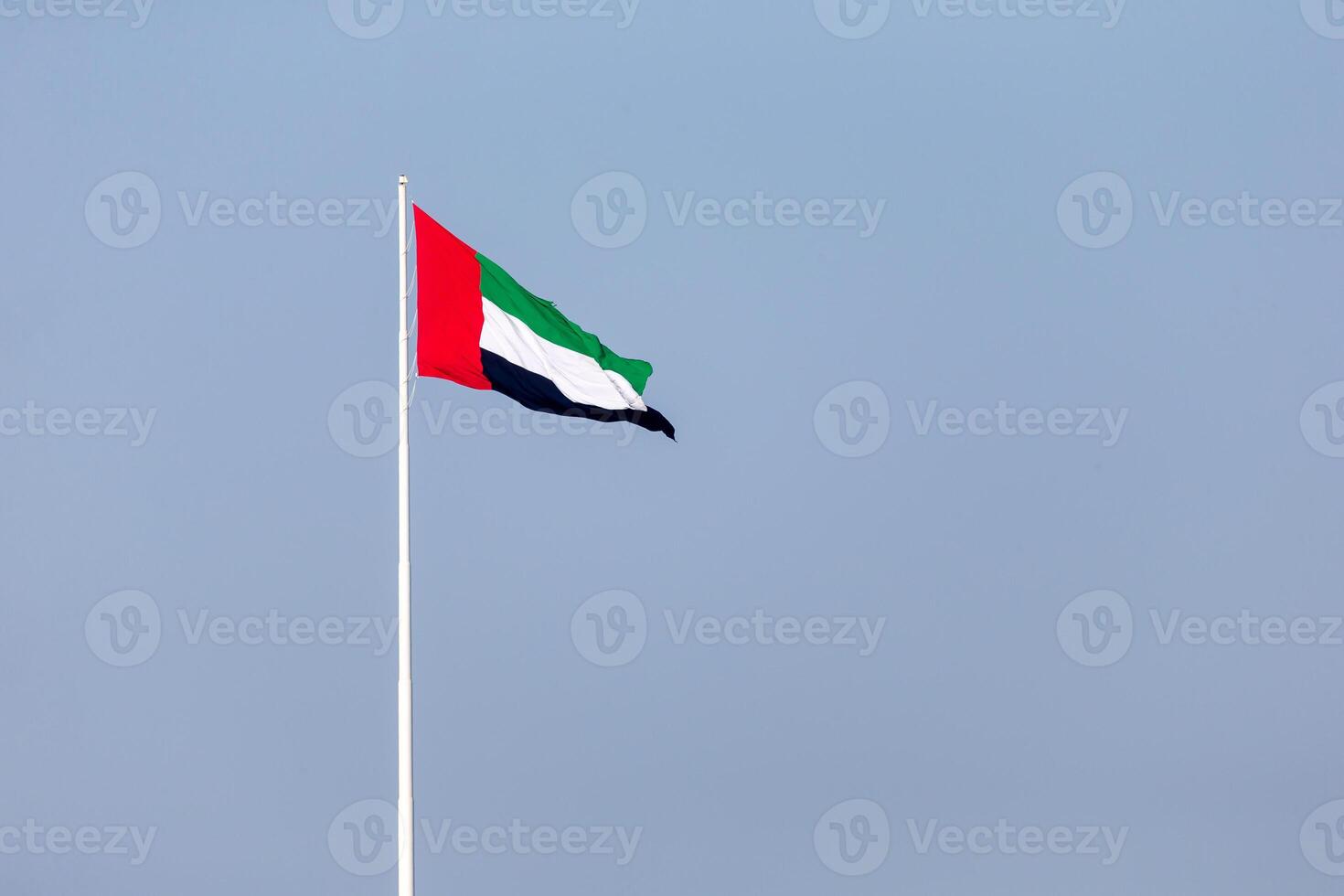 UAE Flag in Abu Dhabi Waving Outside. UAE National Day. Flag Day. photo