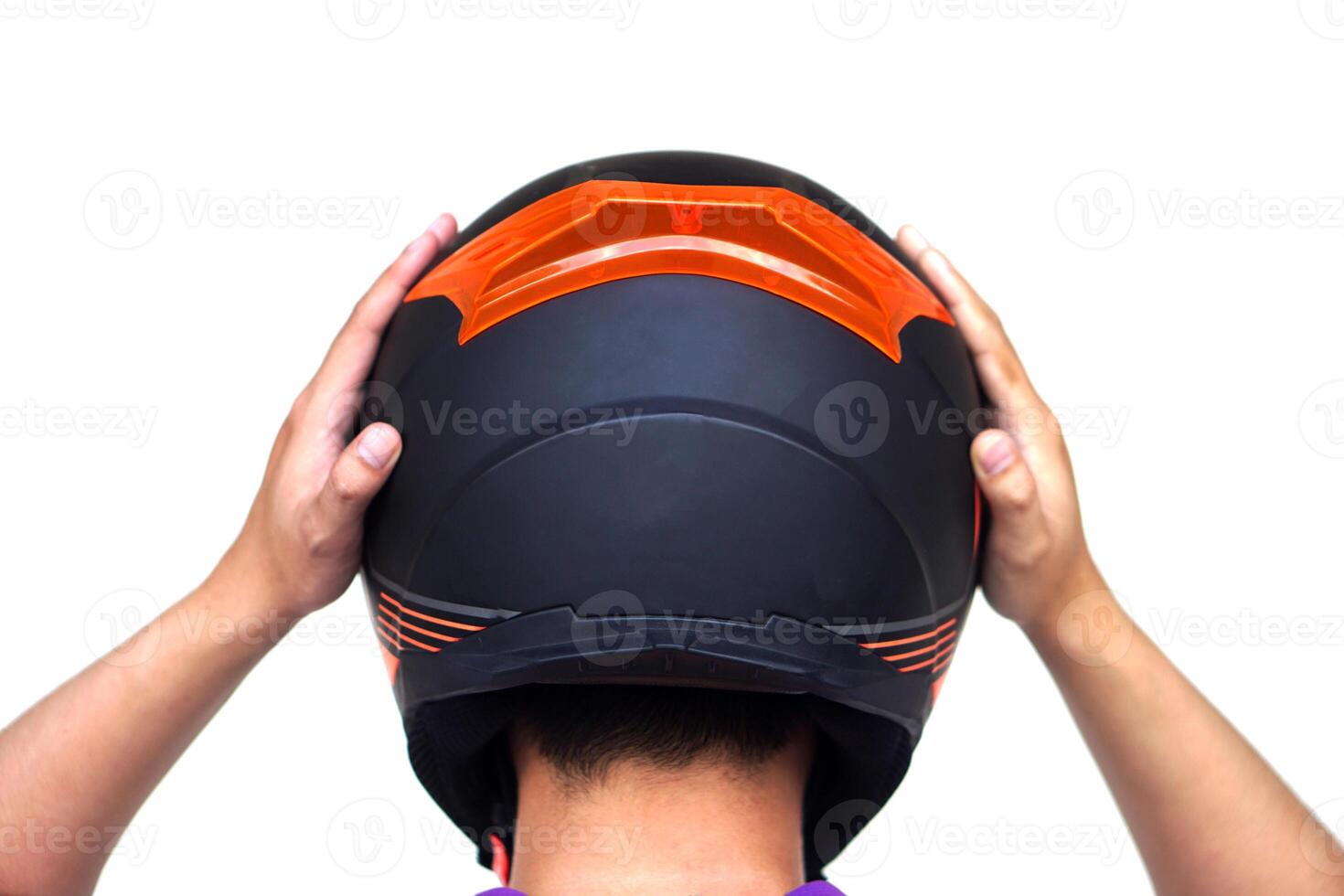 Back view of motorcyclist is wearing helmet. Concept, safety in transportation. Helmet helps prevent head injuries in accidents. Campaign to wear helmet when riding a motorcycle. photo
