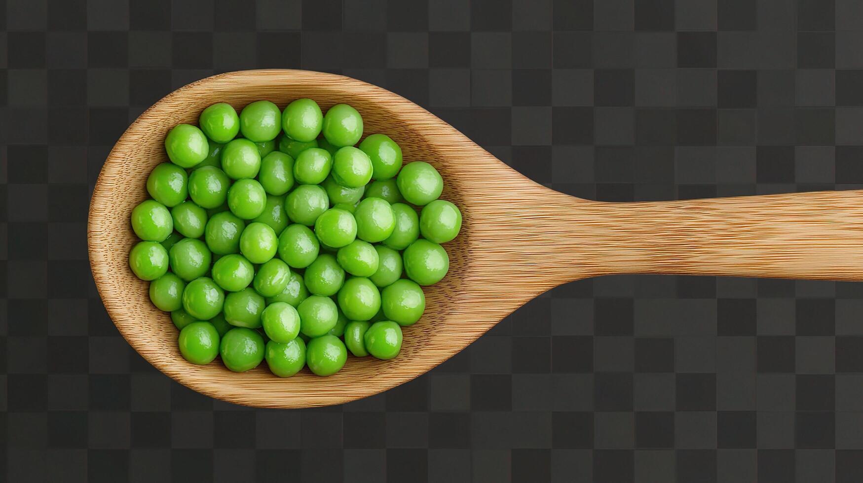 Green peas in wooden spoon on black background photo