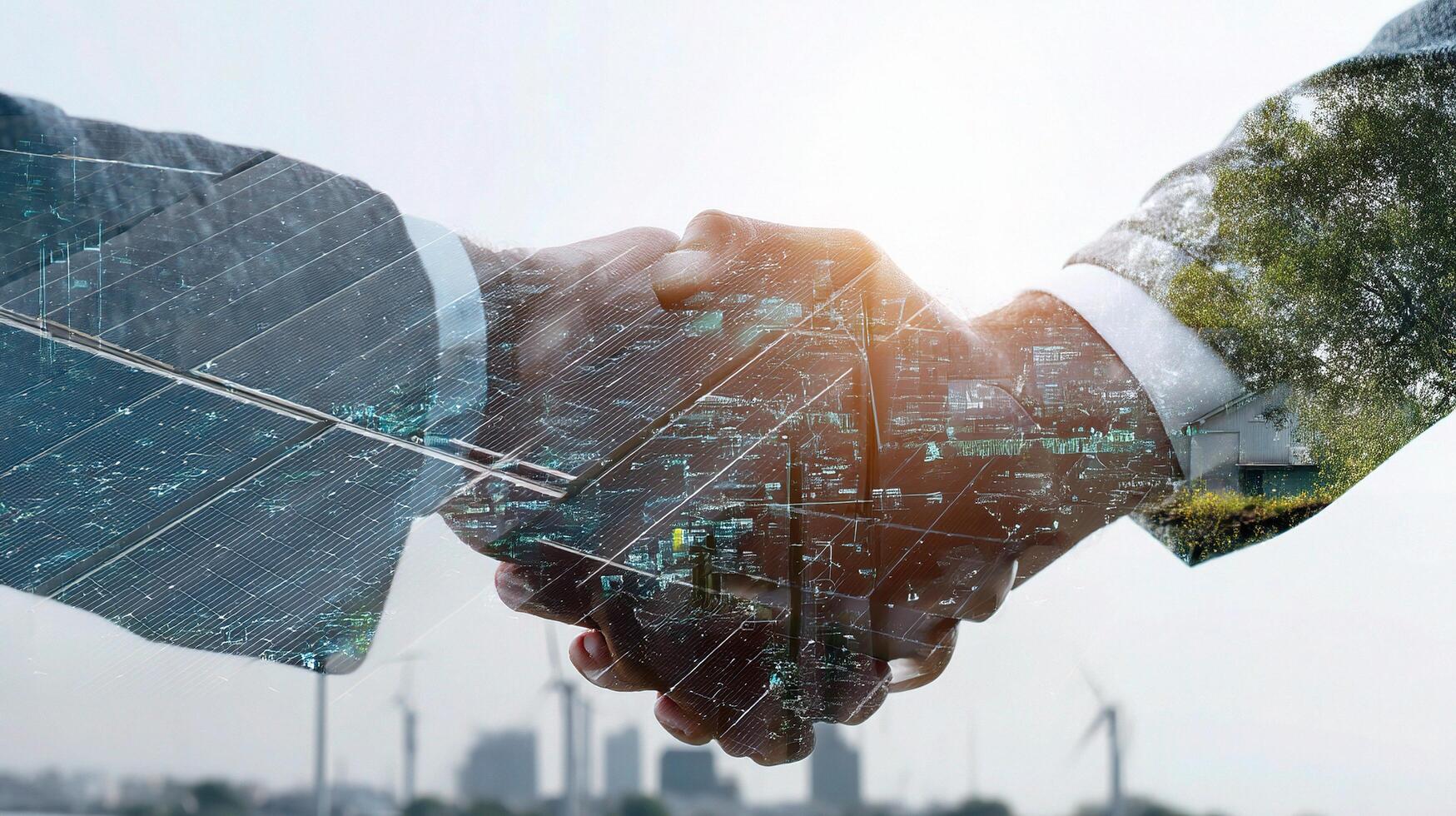 Two business people shaking hands in front of a solar panel photo