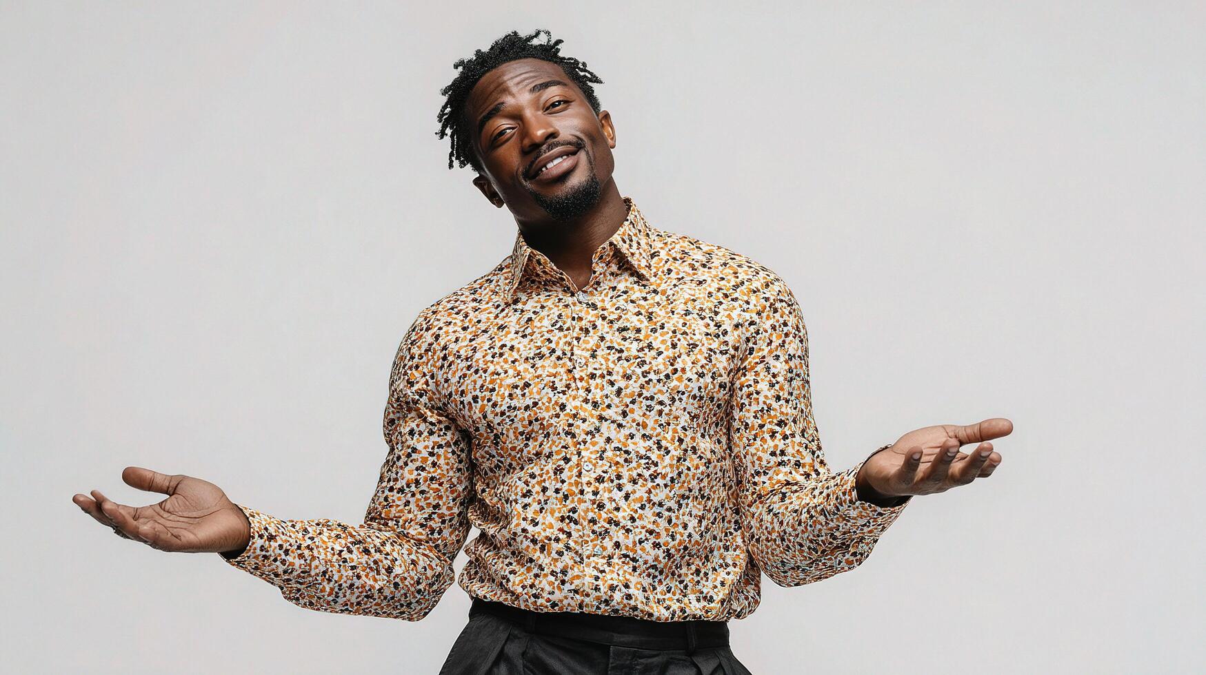 A man with a leopard print shirt and black pants photo