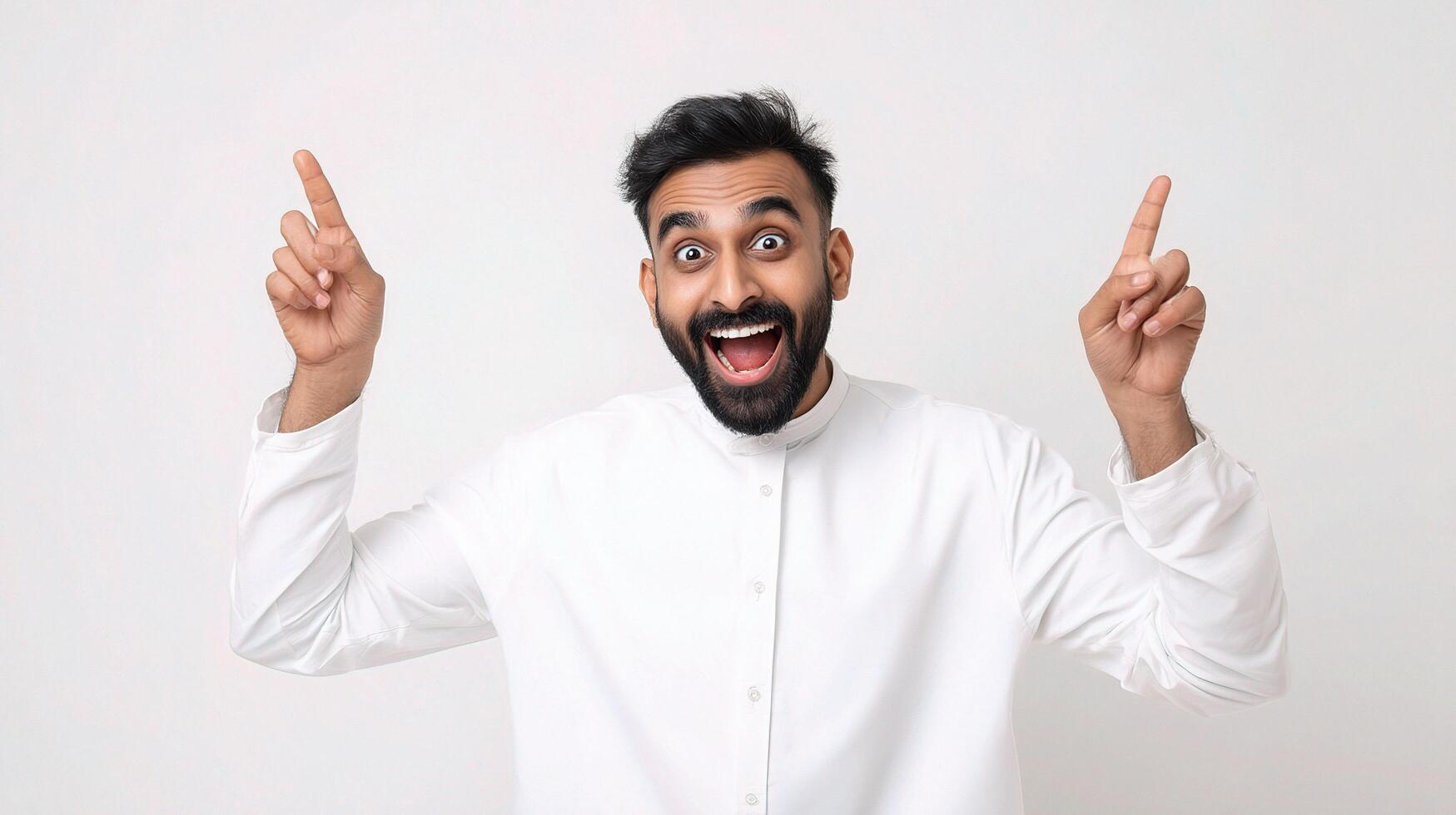 Portrait of a happy arab man with a surprised expression on his face, pointing his fingers photo