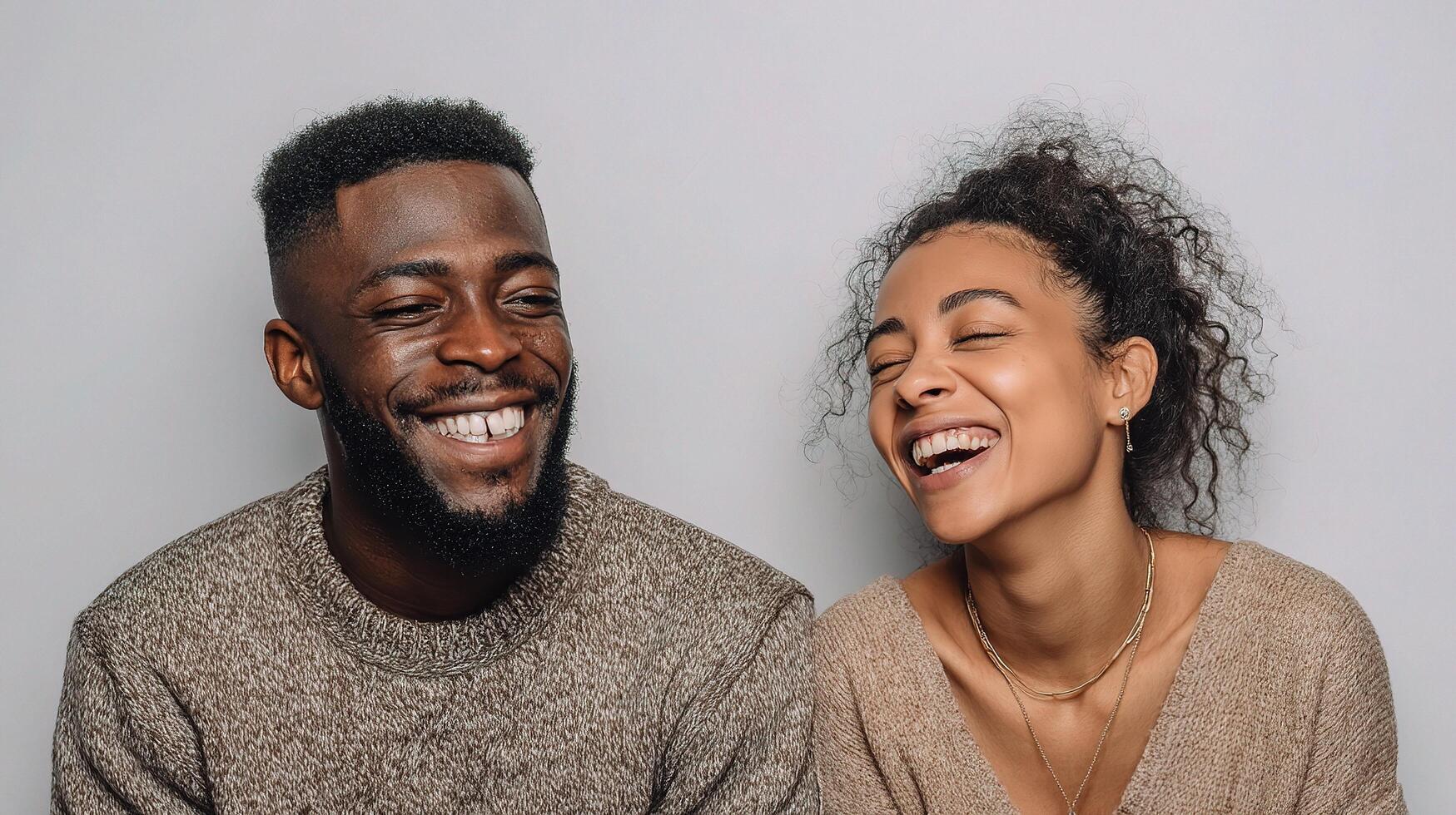 A young couple laughing together photo