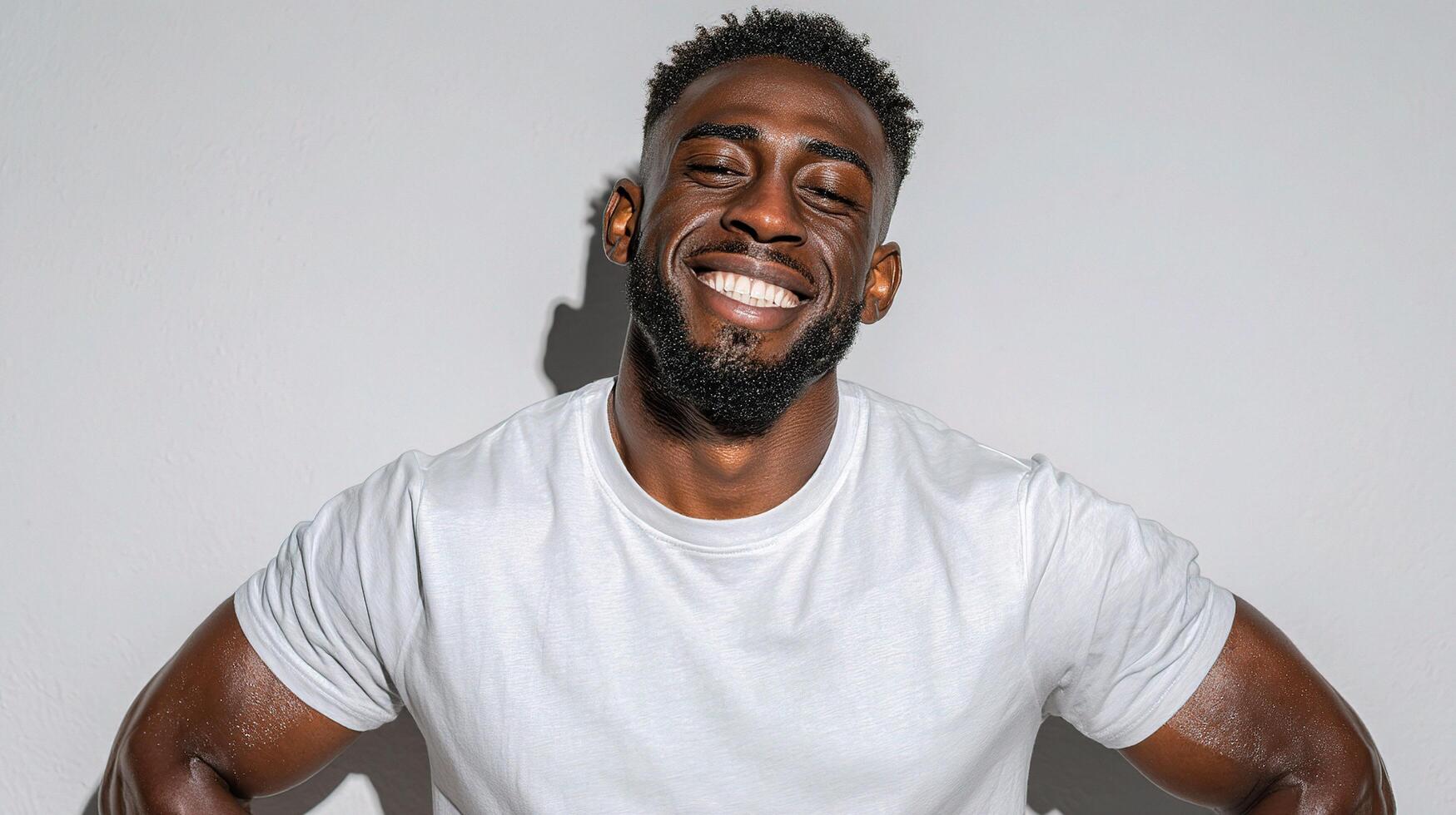 A man with a beard and a white t - shirt photo