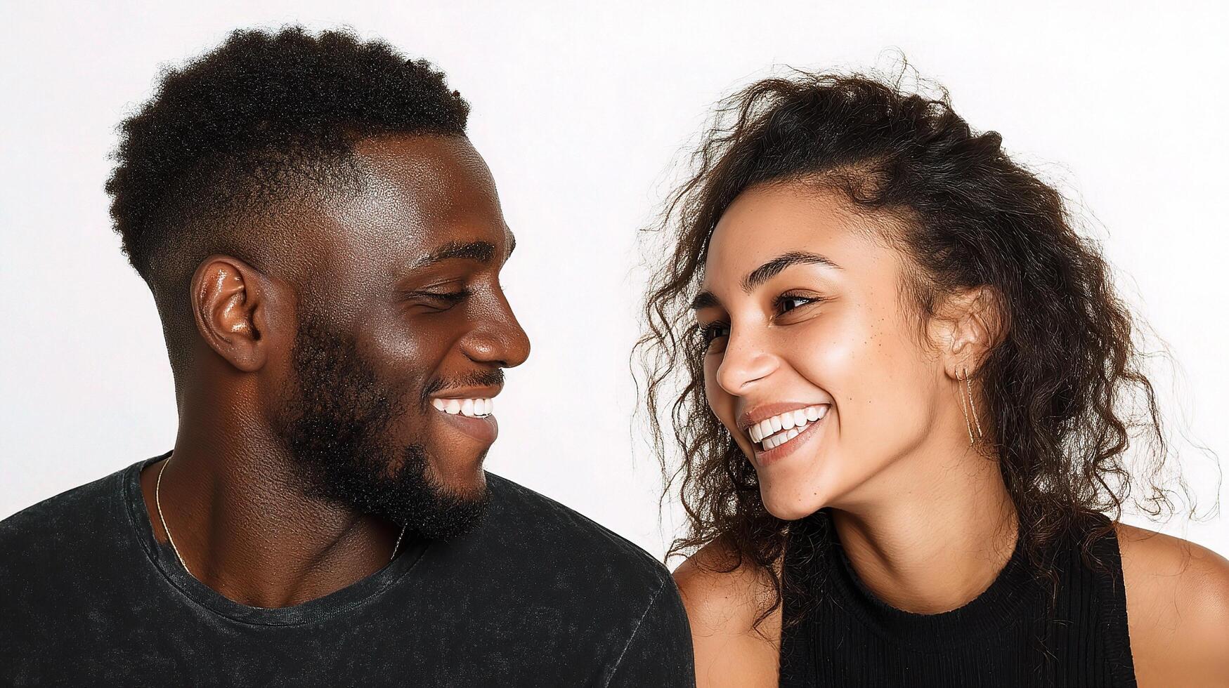 A man and woman smiling at each other photo