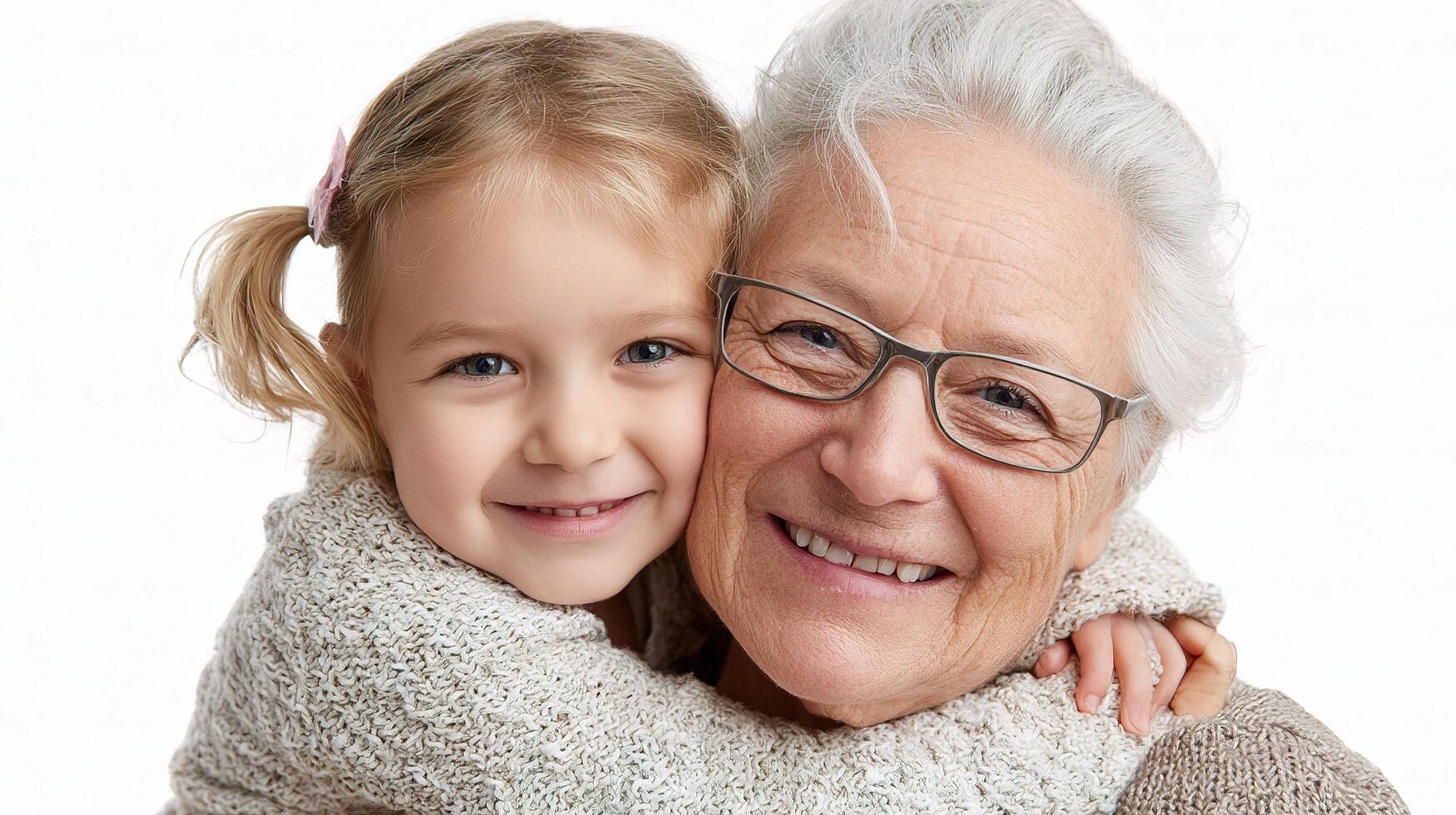 A smiling older woman holding a little girl photo