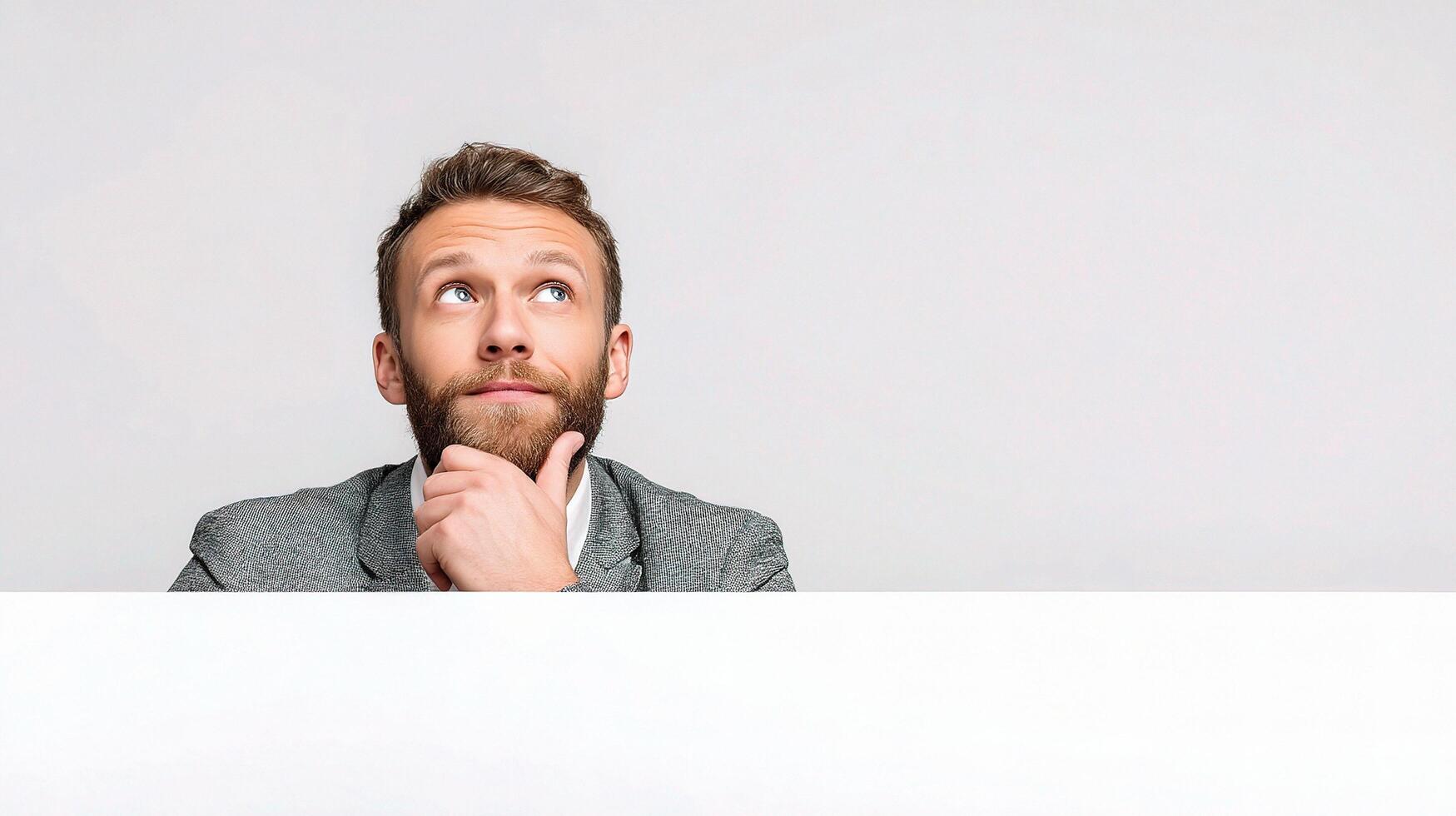 A man with a beard and a white board photo