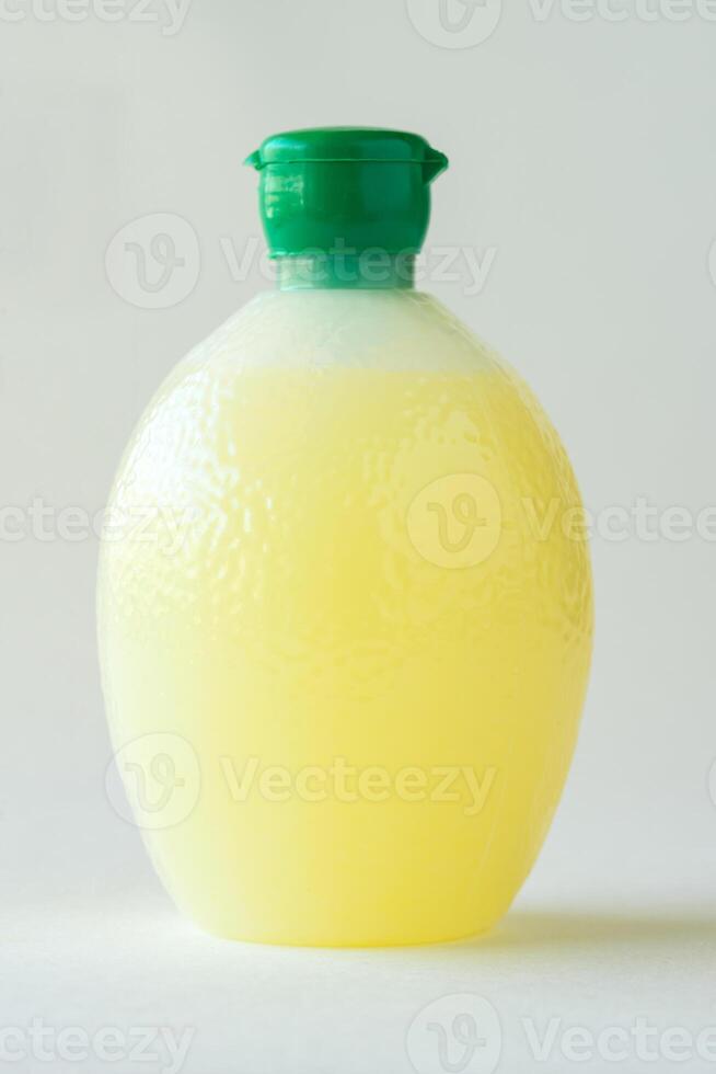 Lemon Juice in Lemon Shaped Container photo