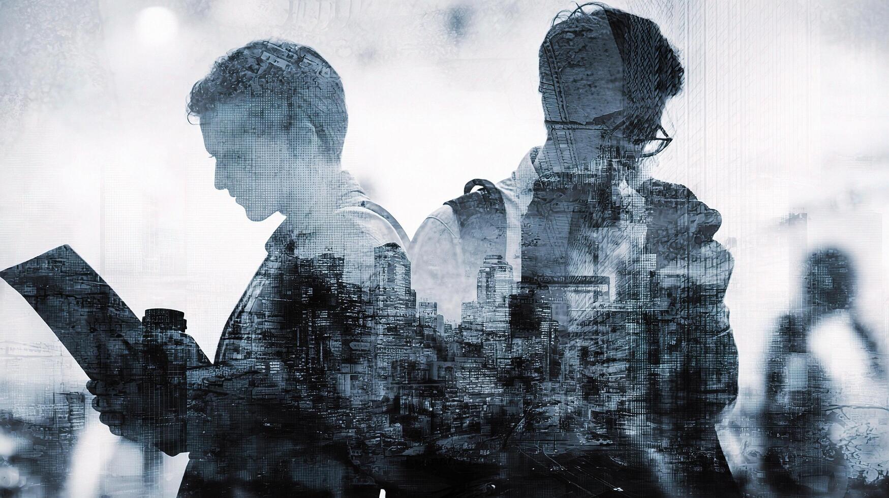 Two people are standing in front of a city photo