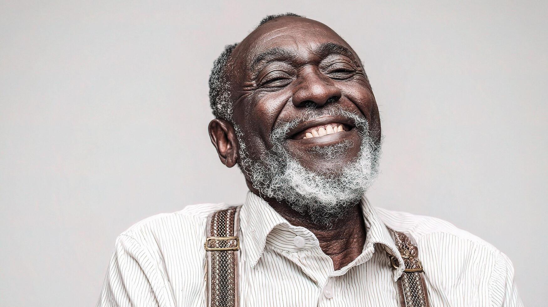 An older man with a beard and a smile photo