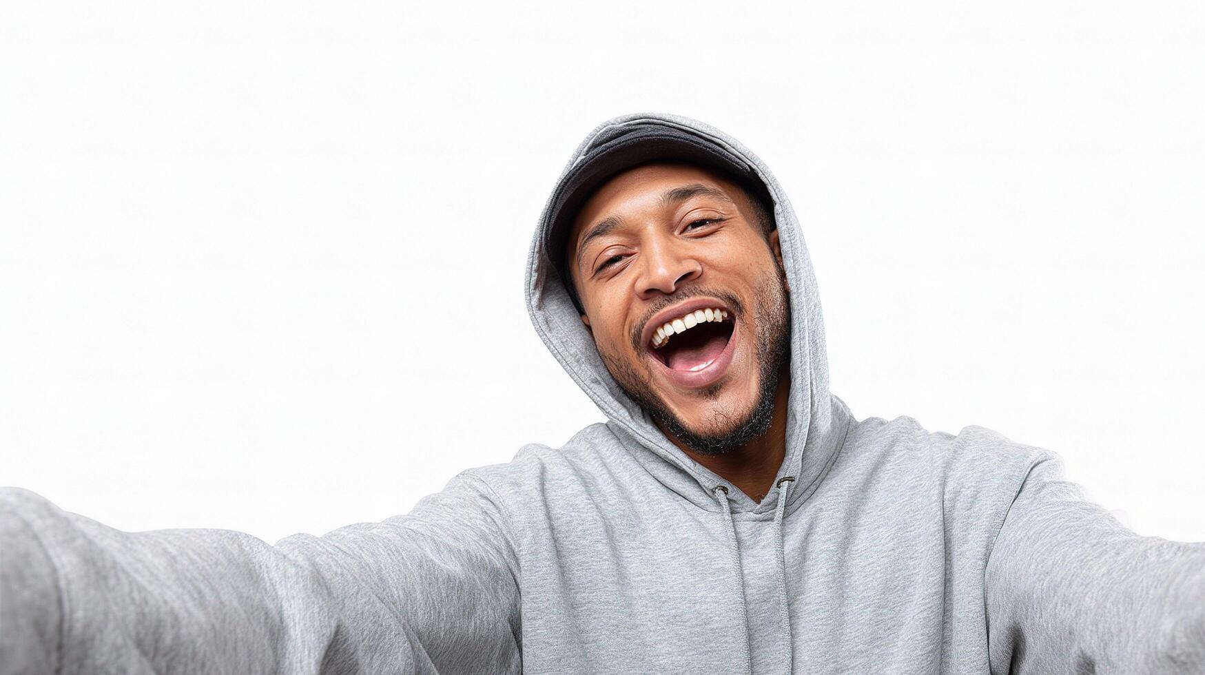 A man in a hoodie is making a funny face photo