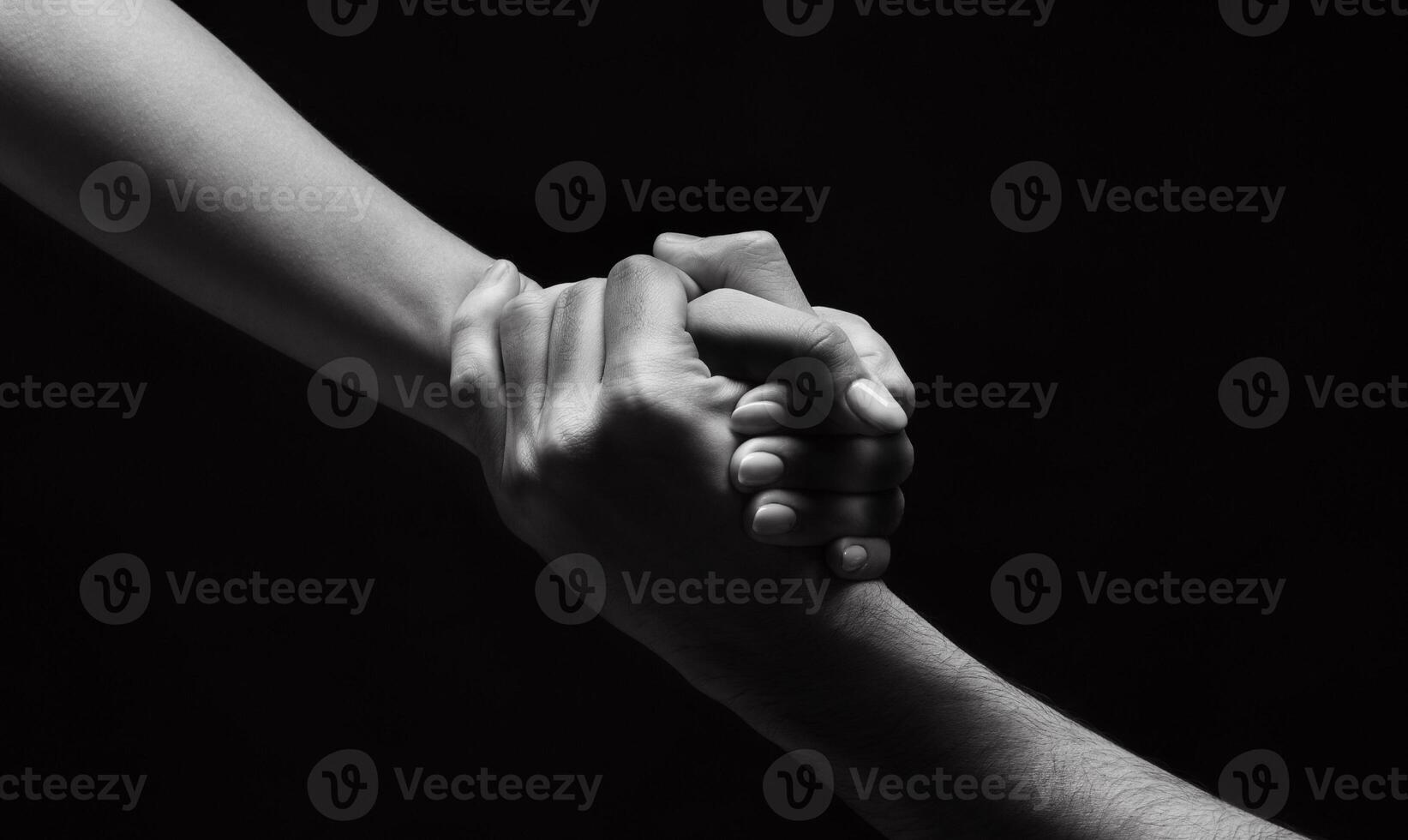 Strong connection. Unrecognizable woman hand helping man to stand up on background, black and white photo