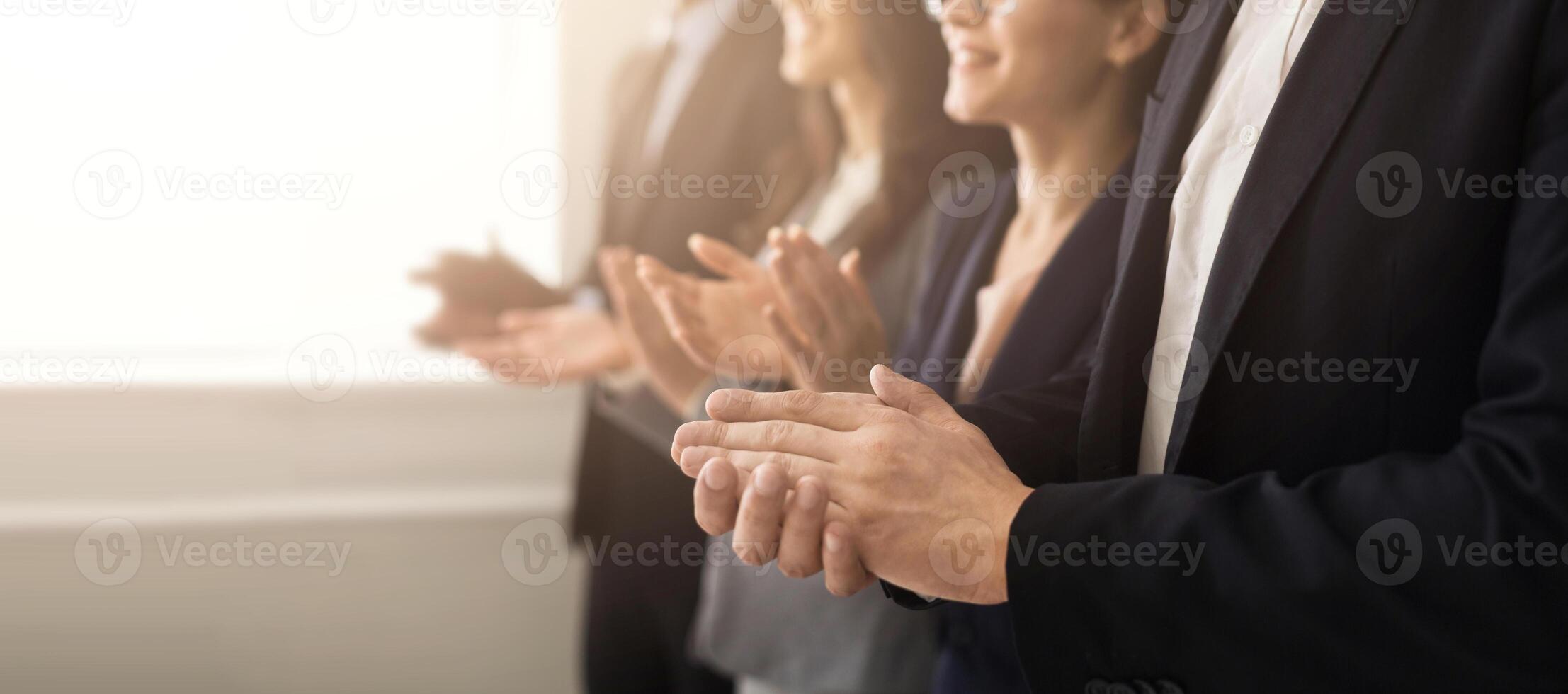 Closeup of business people hands clapping at conference photo