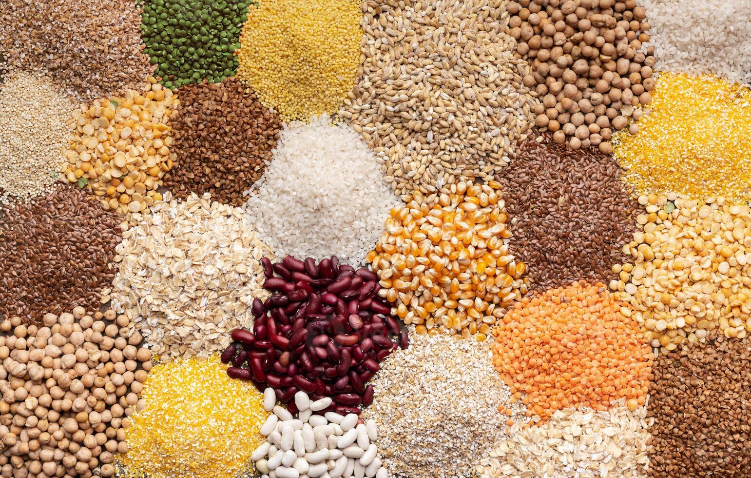 Close up of colored healthy grains and beans background, copy space photo