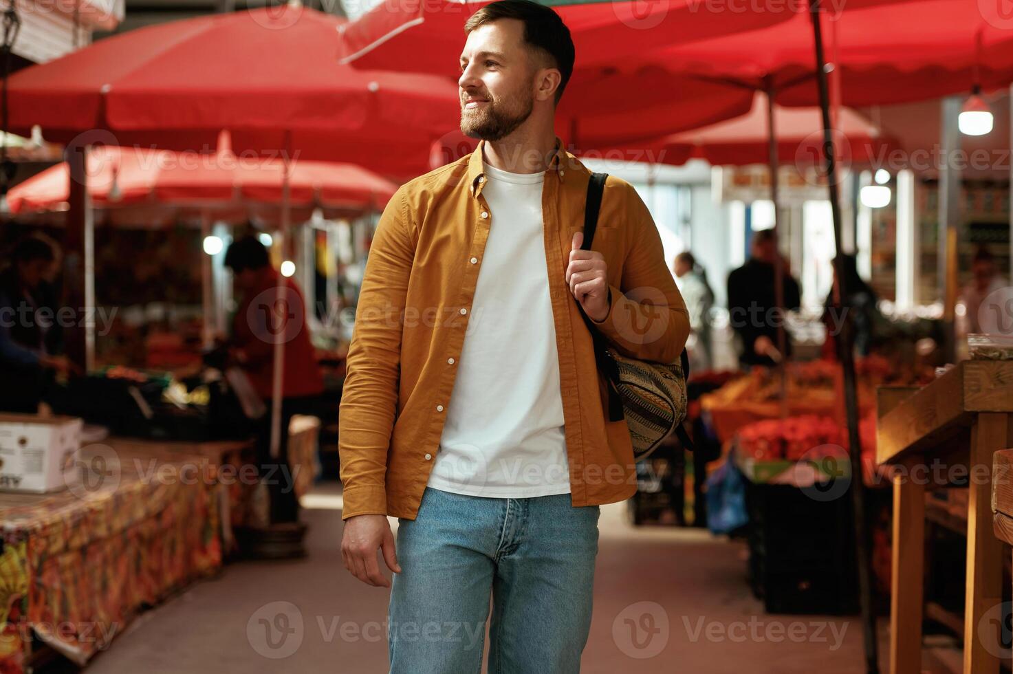 Front view, walking.. Handsome man is on the street market or bazaar photo