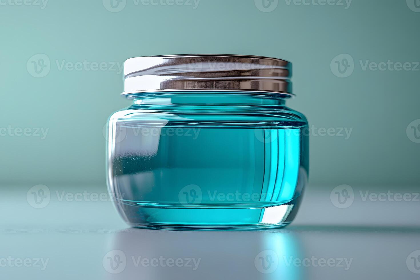 Elegant Glass Jar with Blue Liquid for Cosmetic or Medical Use photo