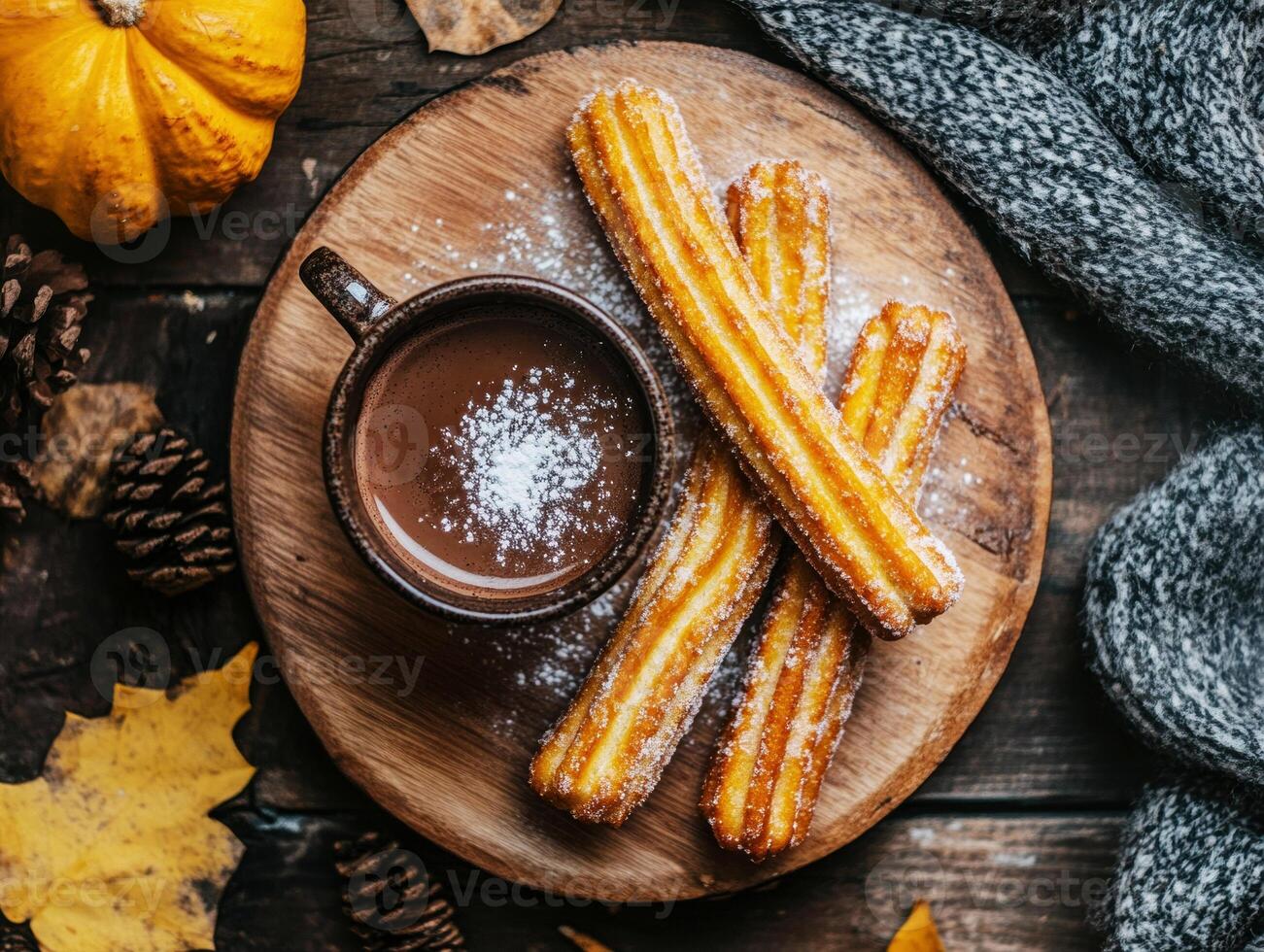 Delicious churros served with hot chocolate on a rustic table photo