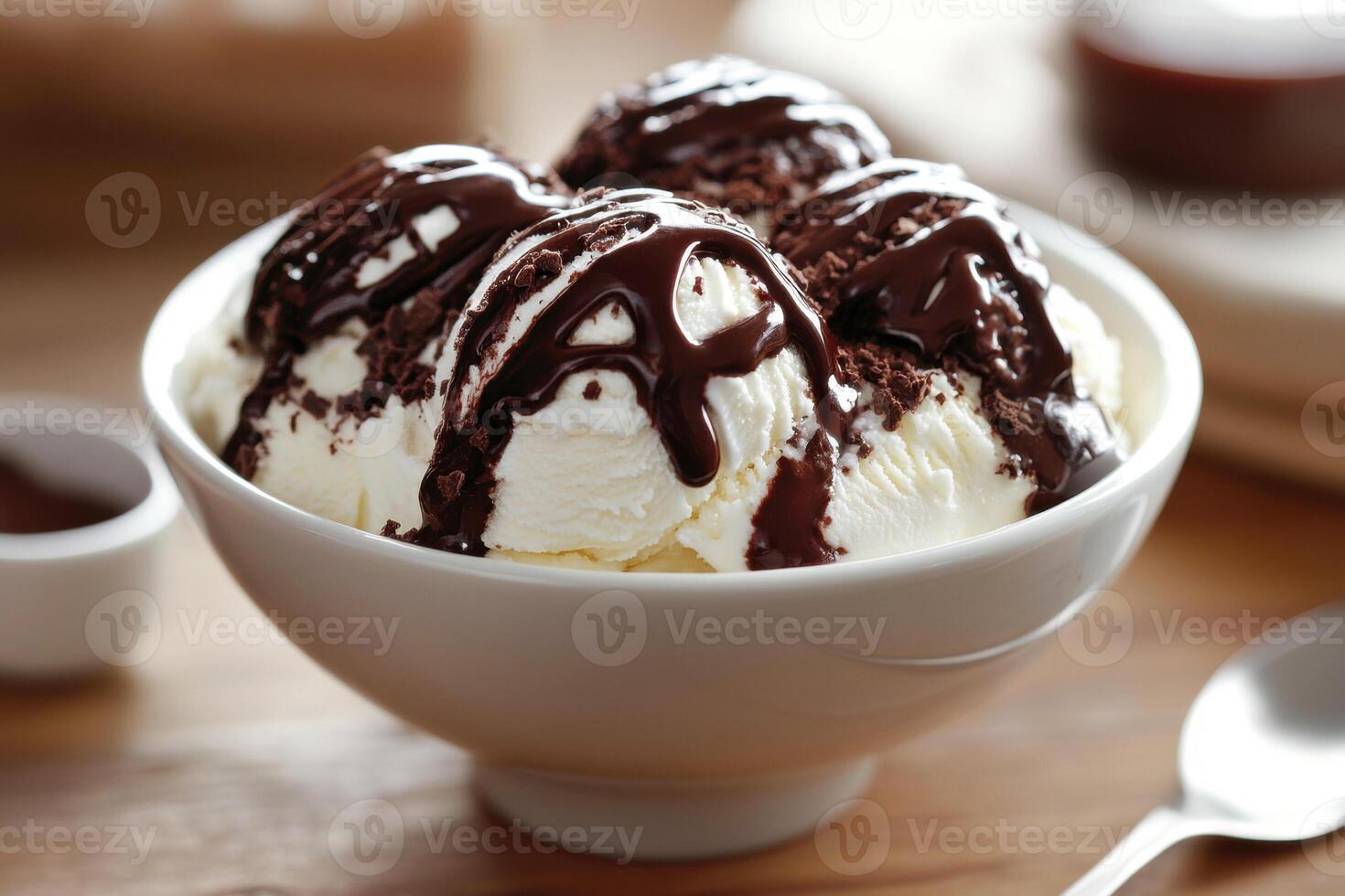 Delicious chocolate sundae served in a bowl with toppings photo