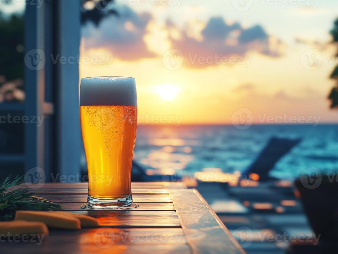Enjoying a refreshing drink by the ocean during sunset photo