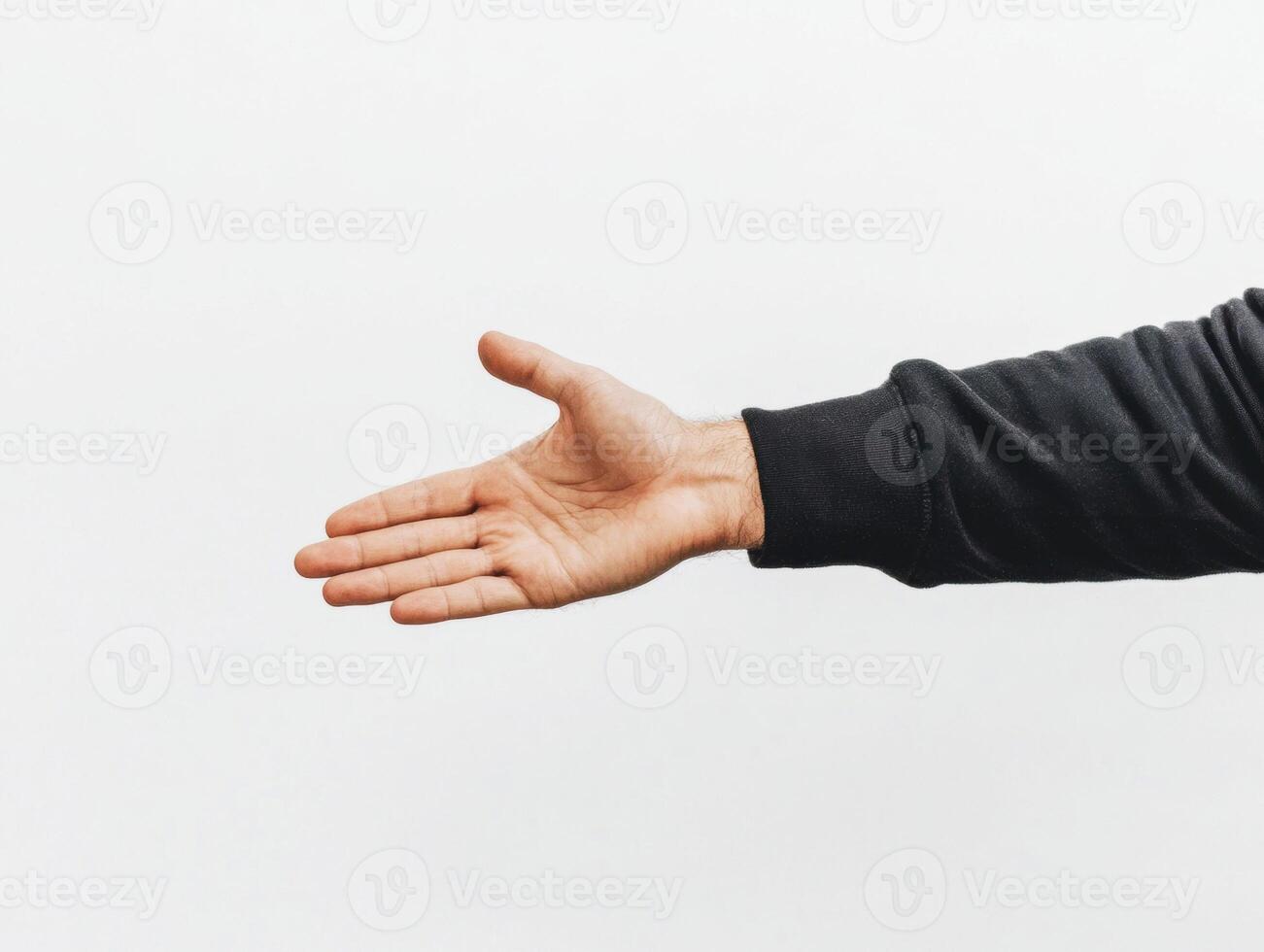 Hand reaching out for a handshake during a business meeting photo