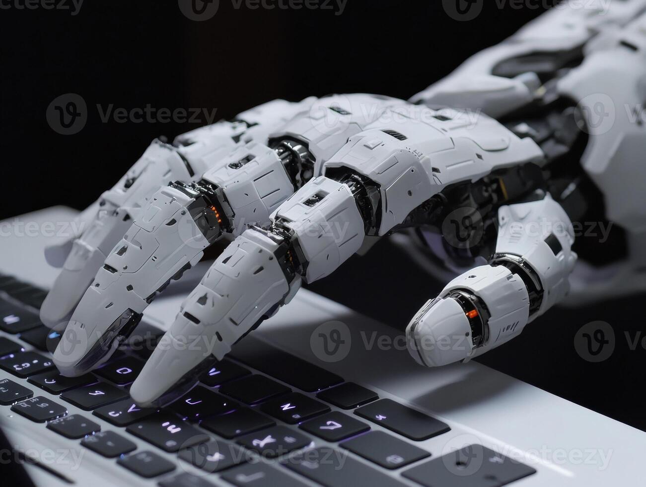 Advanced robotic hand typing on a modern keyboard photo