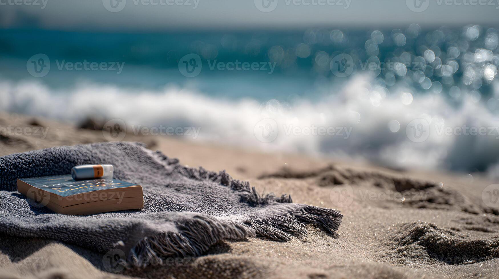Relaxing beach scene with a book and ocean waves creating a peaceful and calming atmosphere photo